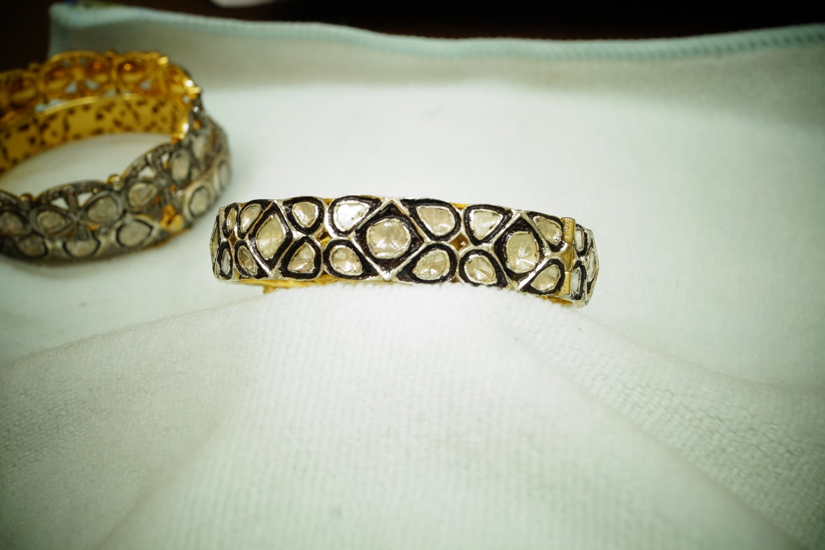 This stunning bangle bracelet is one of its kind.
It consists of:
Diamond- Natural diamonds
Diamond type- Rose cut and uncut diamonds
Diamond color- White with a tint of yellow
Metal- 18k gold plating and sterling Silver
Metal purity- 925 silver or