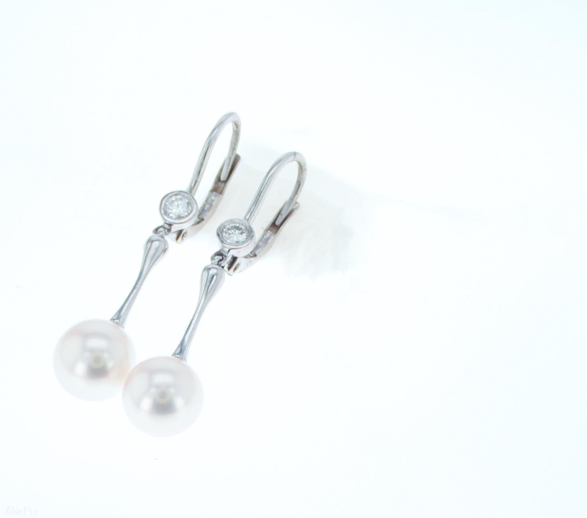 Round Cut Pearl Dangle Earrings with Diamond Accenting For Sale