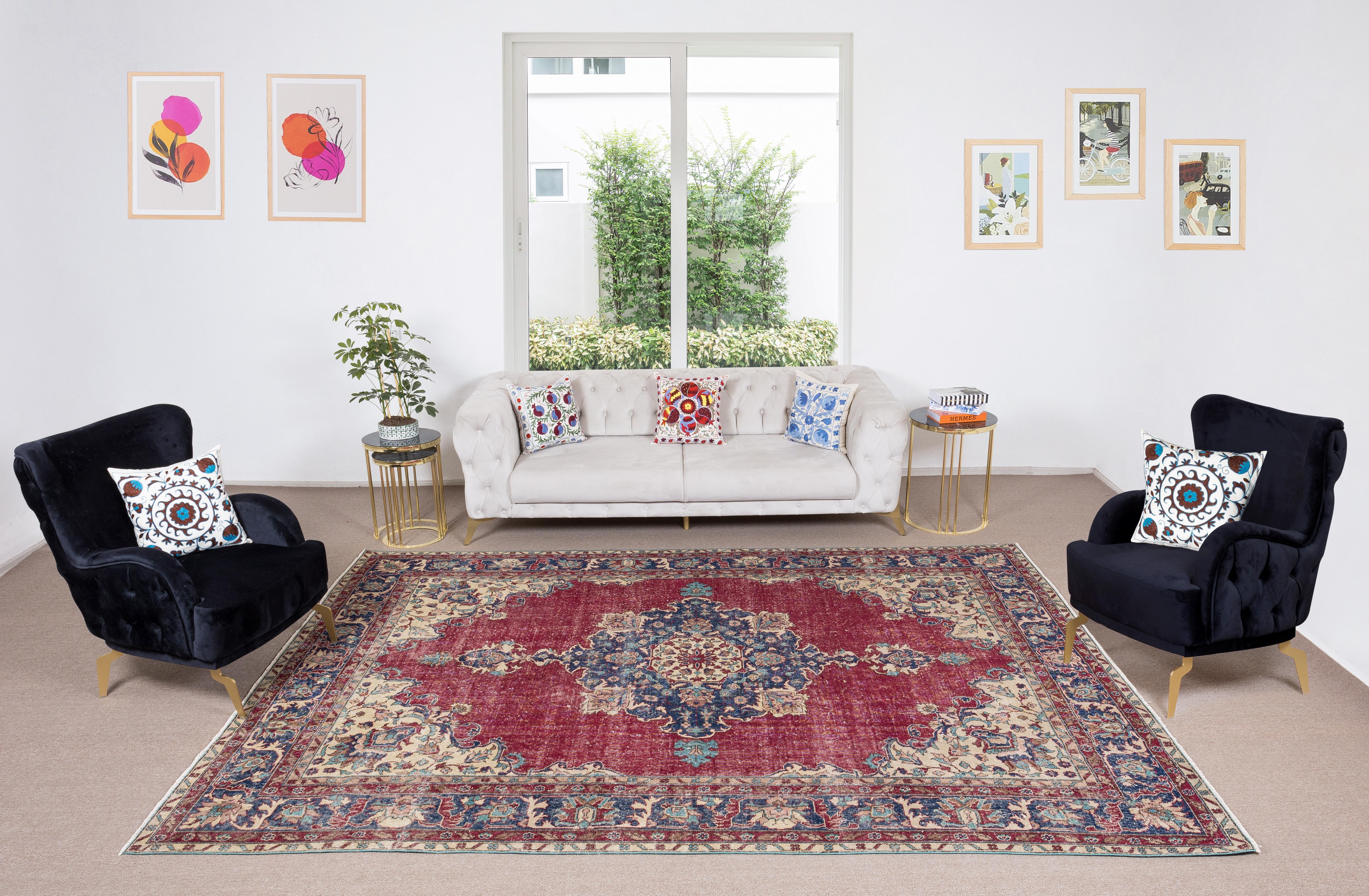 A finely hand-knotted vintage Central Anatolian rug from 1960s. The rug has even low wool pile on cotton foundation. 

Transport yourself to a realm of timeless elegance with this exquisite traditional vintage Turkish wool area rug, a masterpiece