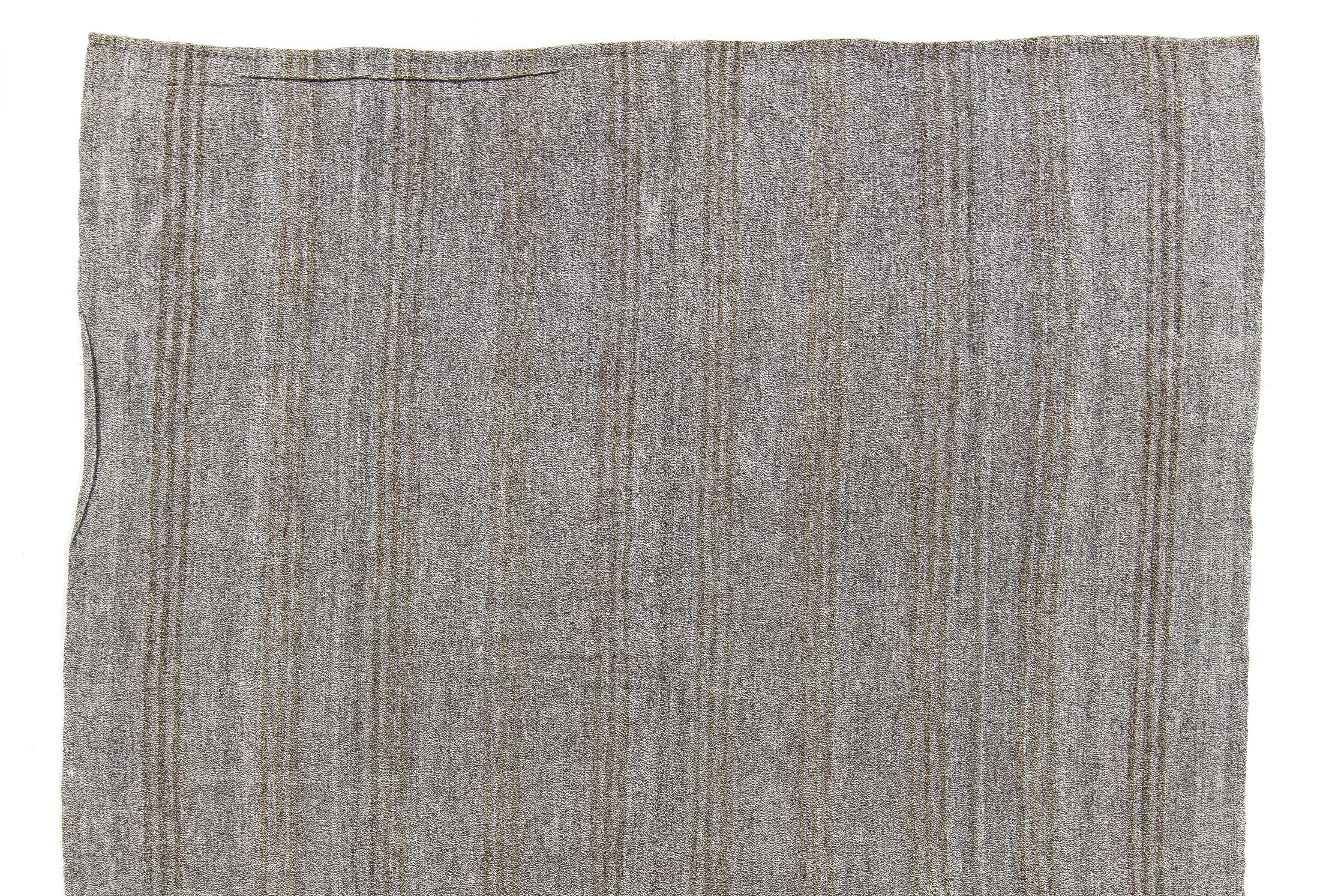 A beautiful handwoven East Anatolian Kilim (flat-weave) with a simple design in a soothing, neutral palette of gray and greenish brown. In very good condition, sturdy and clean, finely-woven, suitable for everyday traffic.