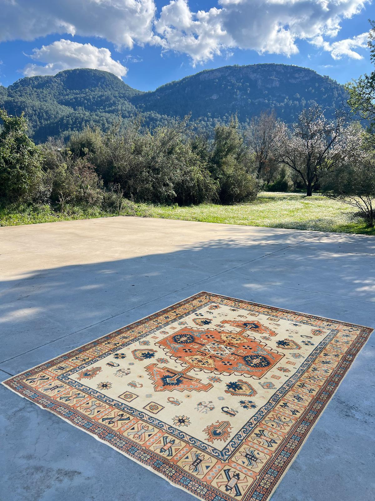 A finely hand-knotted vintage Turkish rug from 1960s. The rug is made of medium wool pile on wool foundation. It is heavy and lays flat on the floor, in very good condition with no issues. It has been washed professionally, the rug is sturdy and can