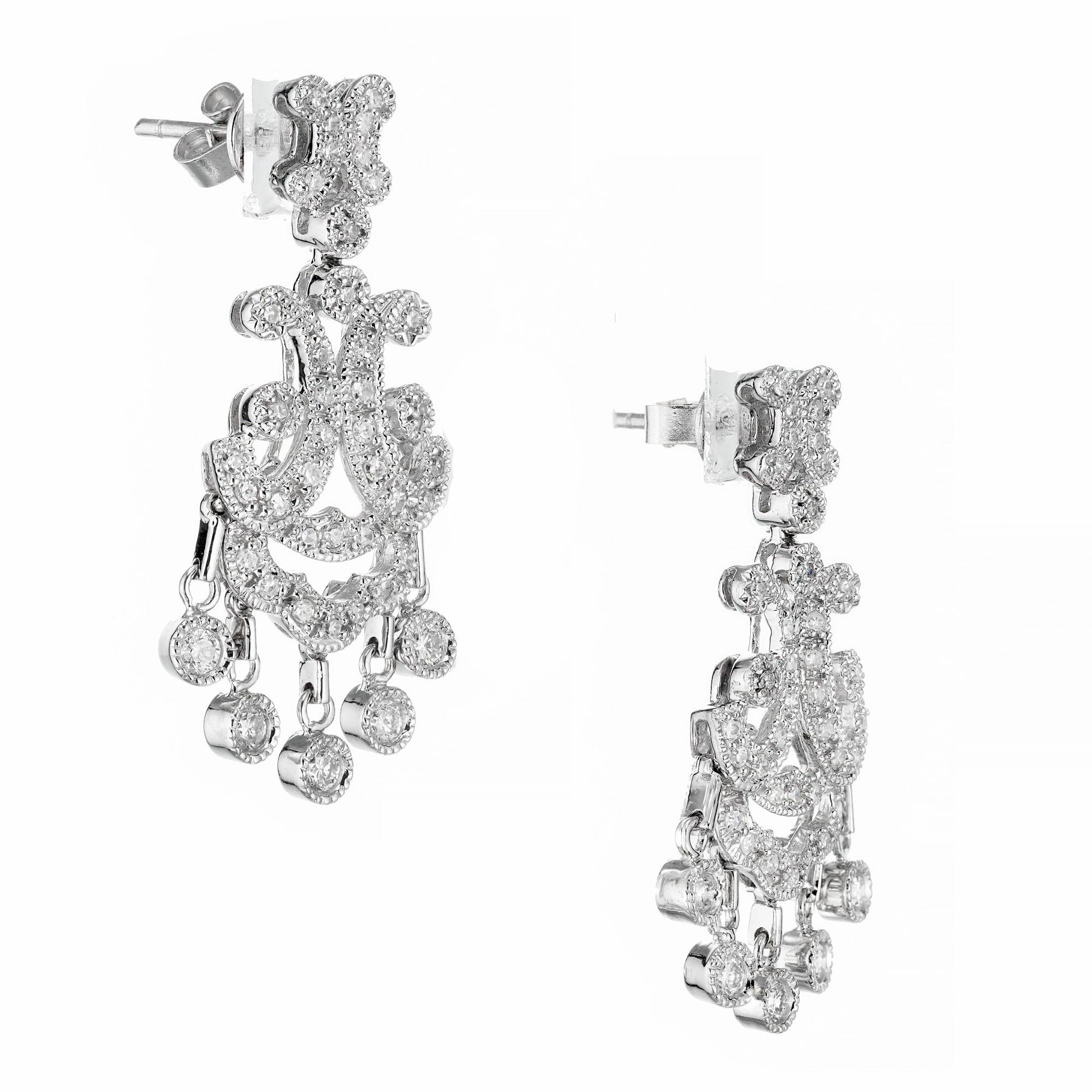 Diamond chandelier dangle earrings. 81 round diamonds set in 14k white gold, with 5 round diamonds that dangle form the base of the earrings. 

86 round diamonds approx. total weight: .79 cts G-H, VS-SI
14k white gold
Length: 1.31 inches or