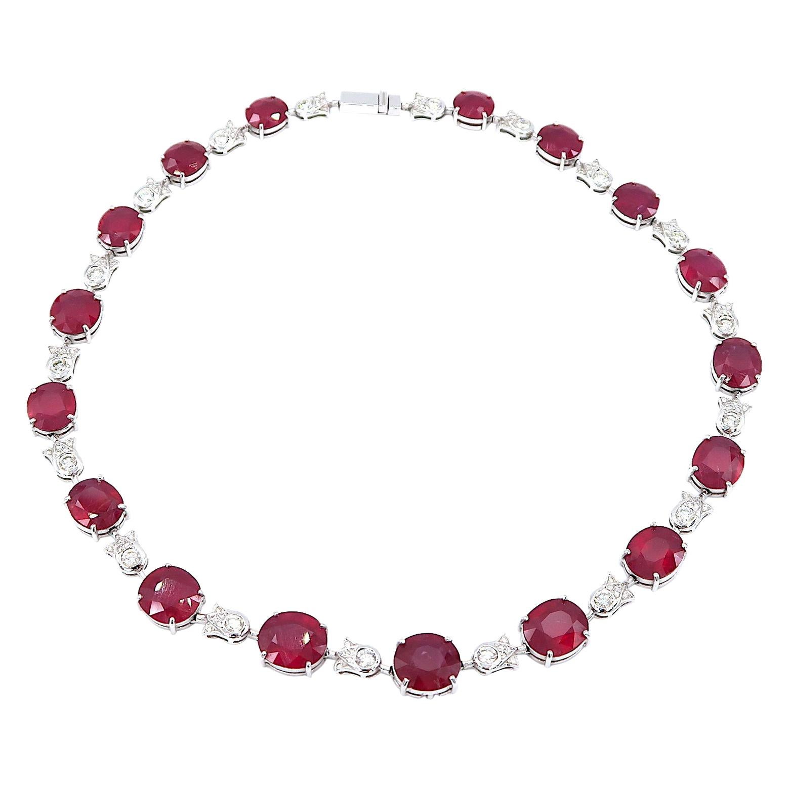 Single Strand Oval Ruby Necklace in 18K White Gold embellished with Diamonds

Ruby: 64.61 total carat
Diamond: 3.64 ct
Gold: 18K White Gold, 33.565