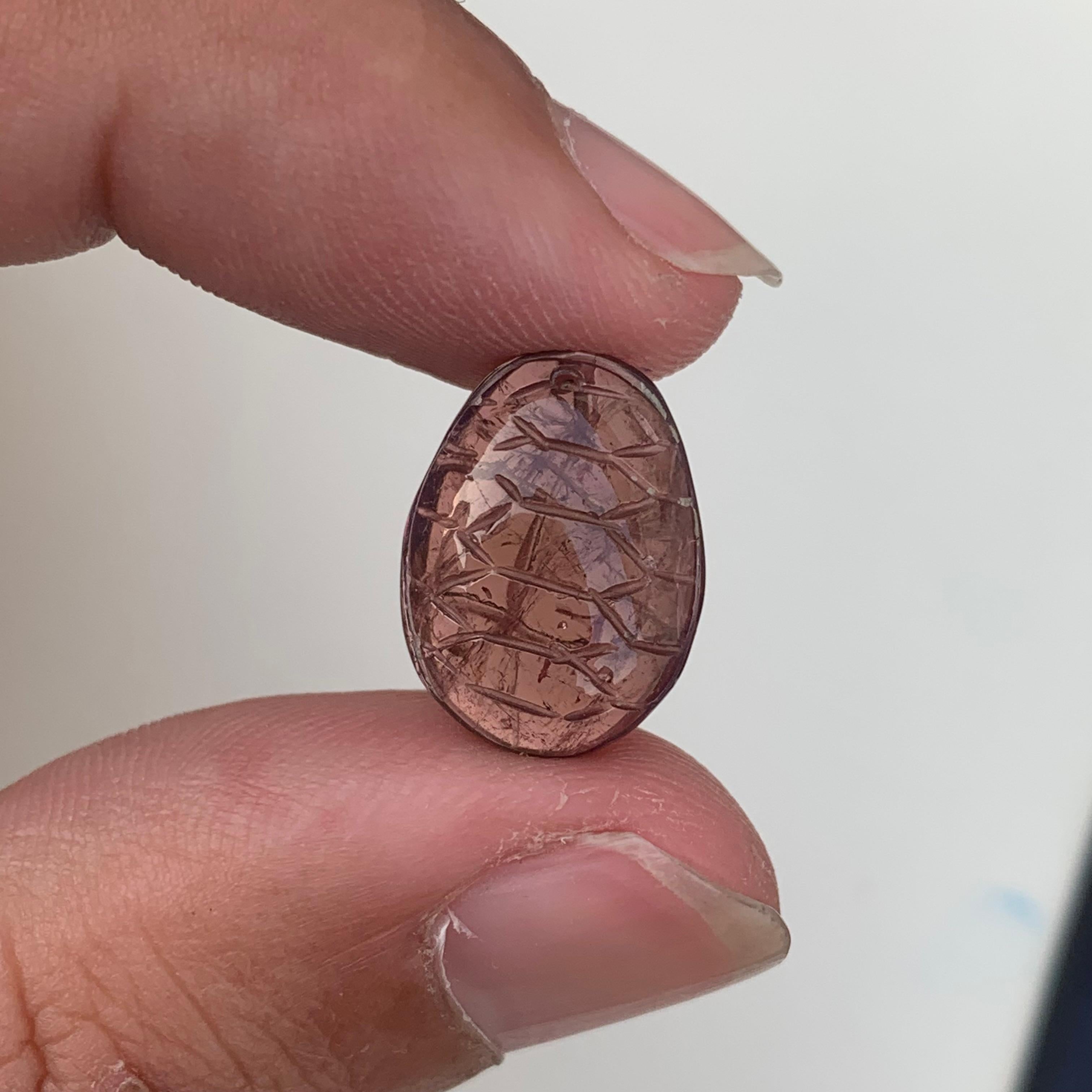 Lovely Loose Peach Color Tourmaline Carving From Madagascar Africa
WEIGHT: 7.90 Carat
DIMENSIONS : 1.6 x 1.1 0.5 Cm
ORIGIN: Madagascar, Africa
Color: Peach 

Tourmaline is an extremely popular gemstone; the name Tourmaline is derived from