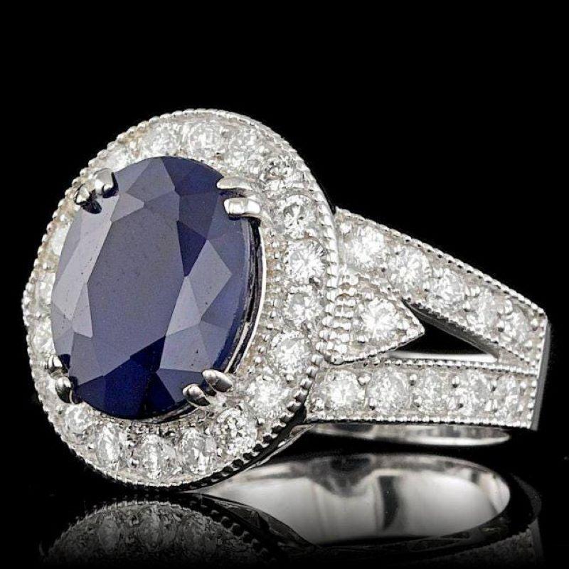 7.90 Carats Natural Blue Sapphire and Diamond 14K Solid White Gold Ring

Total Blue Sapphire Weight is: Approx. 6.40 Carats

Natural Sapphire Measures: Approx. 12.00 x 9.00mm

Sapphire treatment: Diffusion

Natural Round Diamonds Weight: Approx.