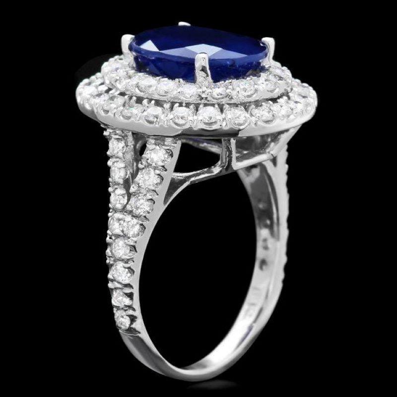 7.90 Carats Natural Blue Sapphire and Diamond 14K Solid White Gold Ring

Total Blue Sapphire Weight is: Approx. 6.00 Carats

Natural Sapphire Measures: Approx. 12.00 x 9.00mm

Sapphire treatment: Diffusion

Natural Round Diamonds Weight: Approx.