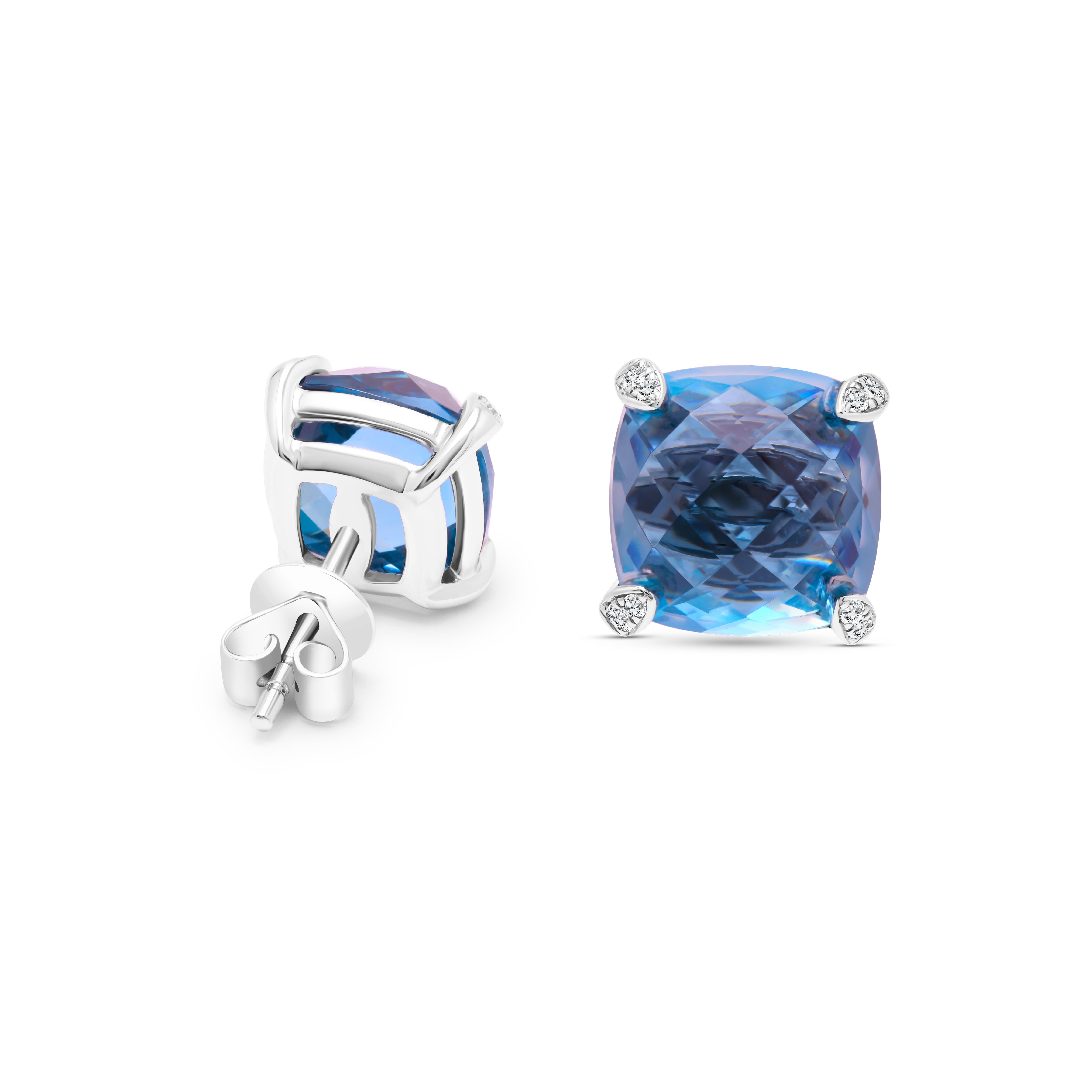 Experience the allure of luxury and sophistication with these enchanting earrings. Adorned with a magnificent 7.92 carats of cushion-cut blue topaz, they exude a captivating, deep blue elegance that's truly mesmerizing. The prongs, embellished with