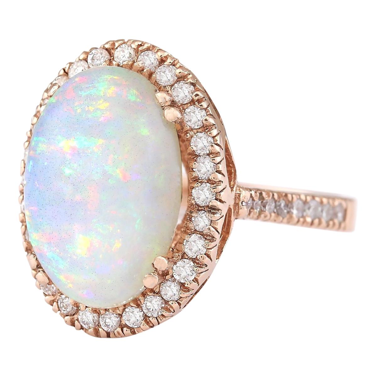 7.92 Carat Natural Opal 14 Karat Rose Gold Diamond Ring
Stamped: 14K Rose Gold
Total Ring Weight: 9.0 Grams
Total Natural Opal Weight is 7.17 Carat (Measures: 16.00x12.00 mm)
Color: Multicolor
Total Natural Diamond Weight is 0.75 Carat
Color: F-G,