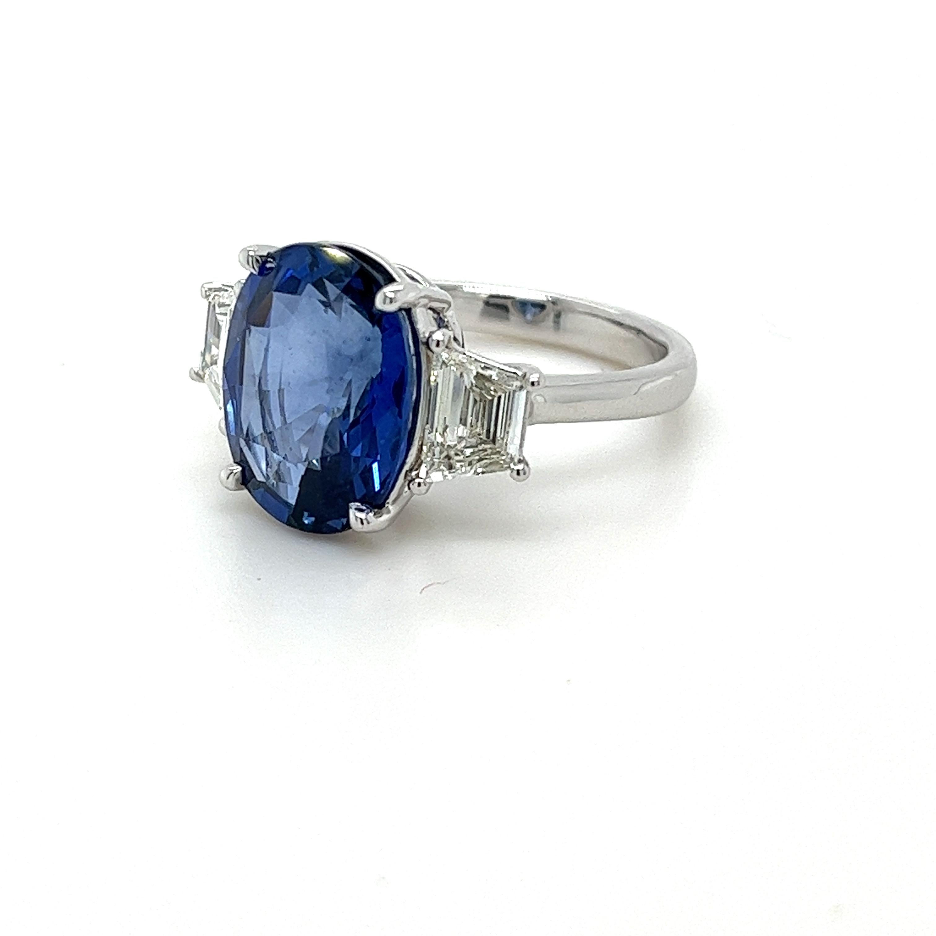 Oval Ceylon Sapphire weighing 7.93 carats
Measuring (13.7x10.4) mm
Trapezoid Diamonds weigh 1.15 carats
Diamond quality VS-H
Set in platinum ring
8.14 grams