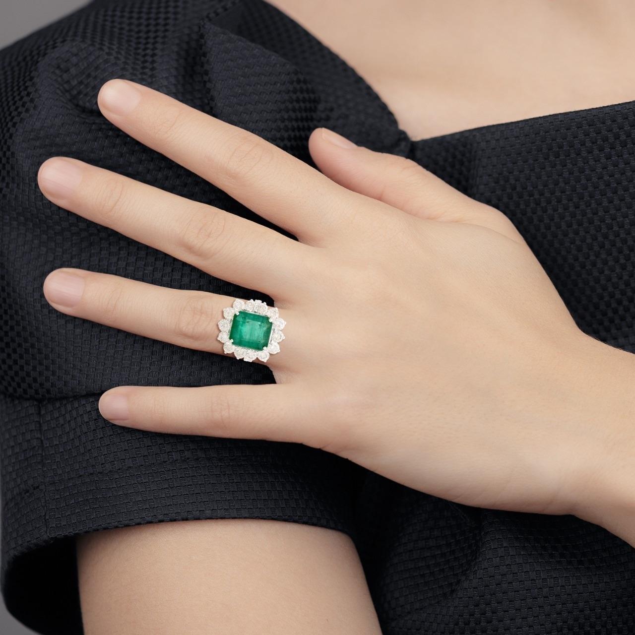This ring has been meticulously crafted from 14-karat gold.  It is hand set with 7.93 carats emerald & 3.50 carats of sparkling diamonds. 

The ring is a size 7 and may be resized to larger or smaller upon request. 
FOLLOW  MEGHNA JEWELS storefront