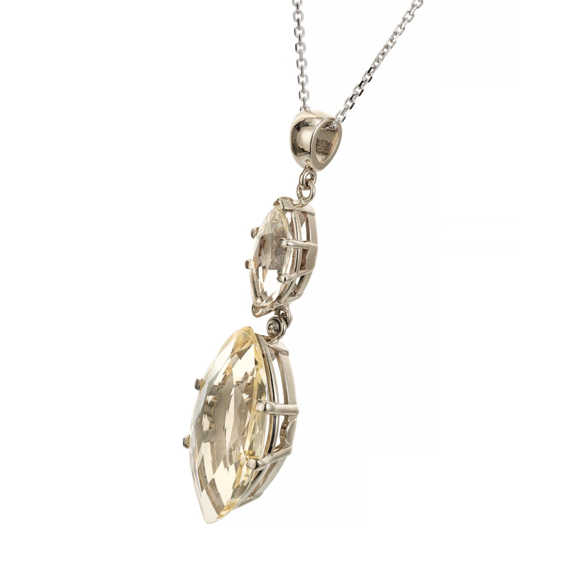 Two marquise cut Heliodor beryl pendant necklace. Light yellow 6.62ct marquise dangle with one 1.34ct marquise cut top stone set in 14k white gold. 16 inch white gold chain. 14k yellow gold bail.

1 marquise cut Heliodor approx. total weight
