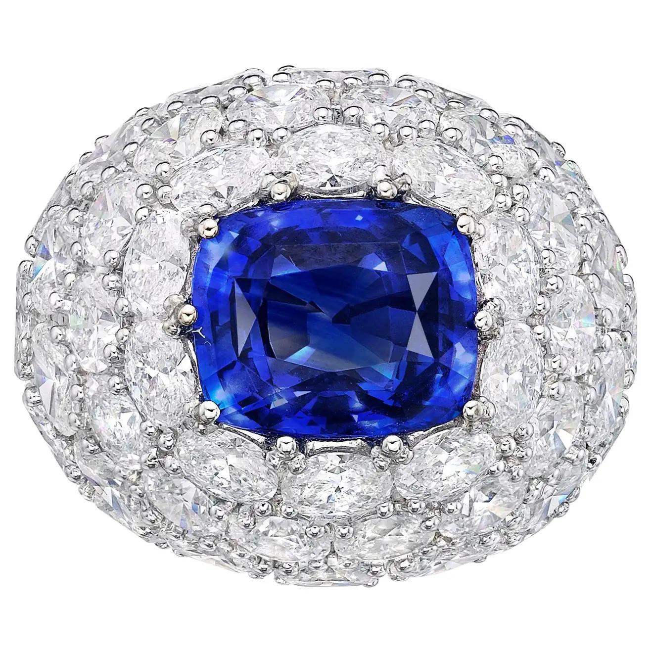 Primary Stone: Sapphire ( Sri Lanka )
Shape : Oval Cut
Sapphire Weight: 7.96 Carats
Measurements Sapphire: 11.65mm x 9.80mm x 6.88mm
Color: Royal Blue
Accent Stones: Genuine Diamond
Shape Or Cut Diamond: Numerous Round Brilliants
Average