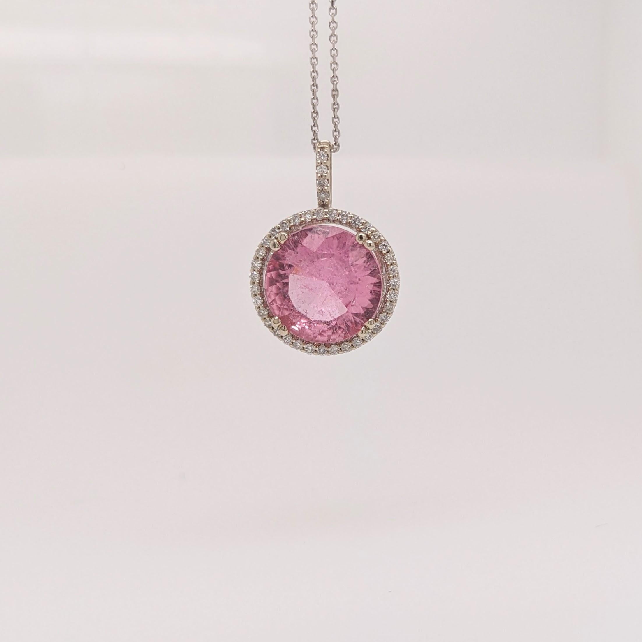 A beautifully cut bubble gum pink tourmaline pendant with natural diamonds!

Specifications:

Item Type: Pendant

Stone Specs:
Type: Tourmaline
Treatment: Heated
Hardness: 7-7.5
Shape: Round
Size: 12.5mm
Weight: 7.96 cts

Metal: 14k/2.34