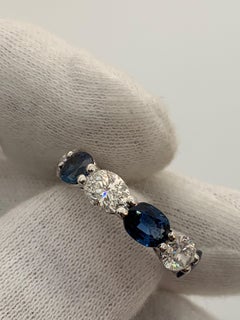 7.97 Carat Sapphire and Oval Diamond East West Eternity Band Ring
