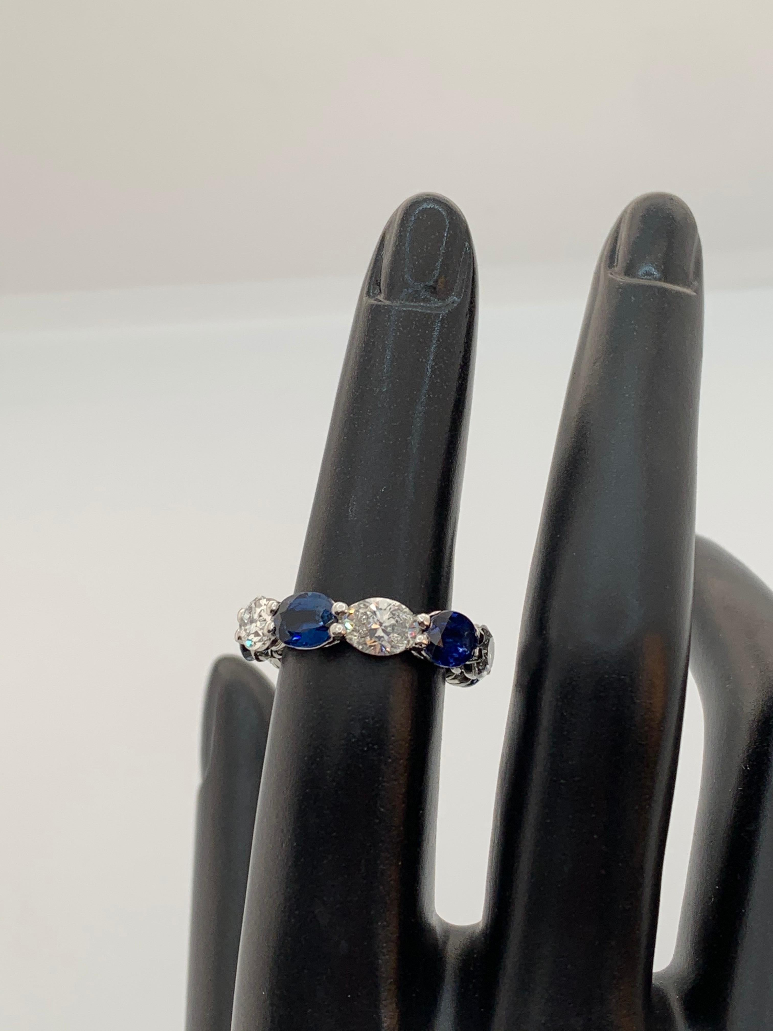 Contemporary 7.97 Carat Sapphire and Oval Diamond East West Eternity Band Ring For Sale