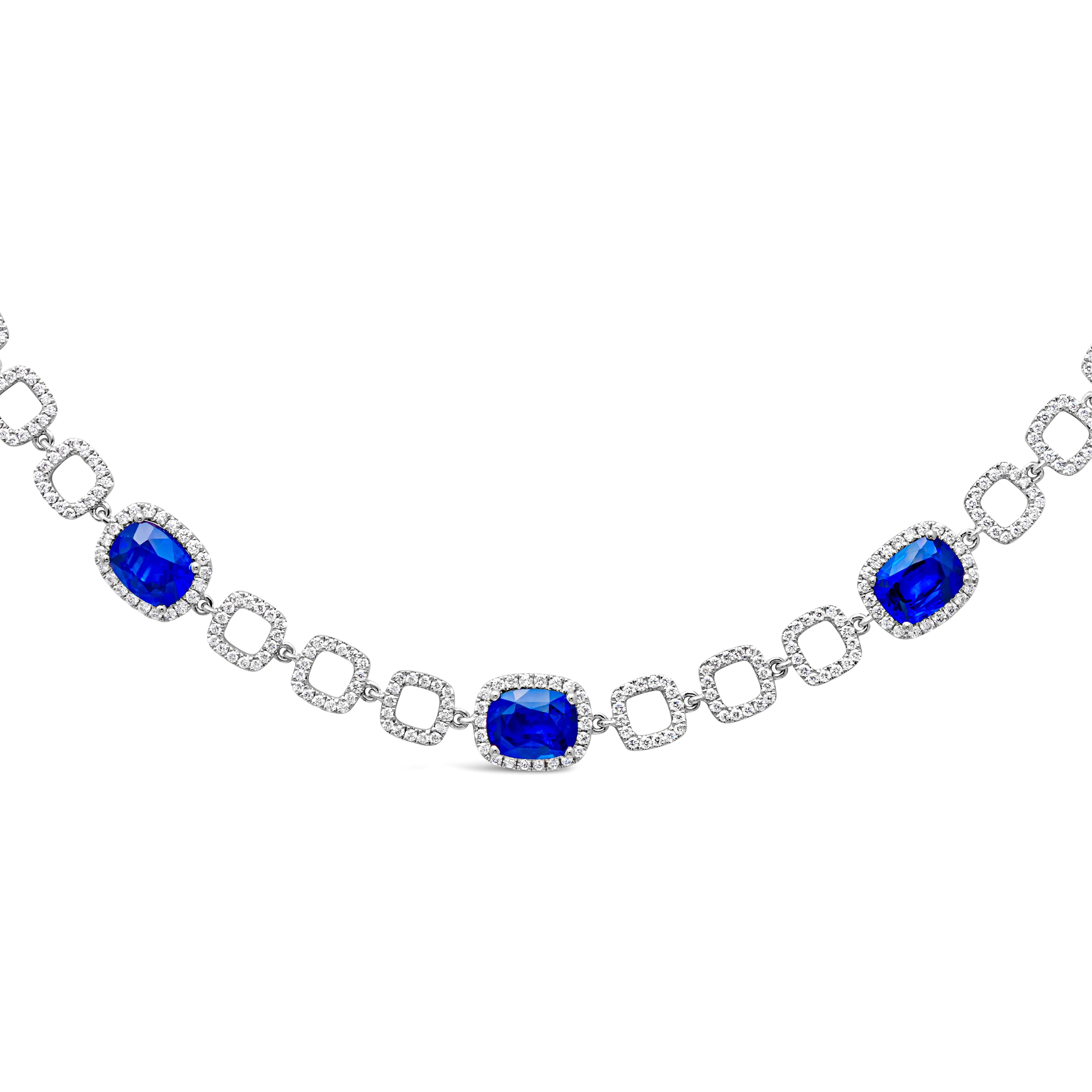 A fashionable and stunning tennis line pendant necklace showcasing a color-rich 7 cushion cut blue sapphires weighing 7.975 carats total, set in a classic four prong basket setting and surrounded by brilliant round cut melee diamonds in a halo