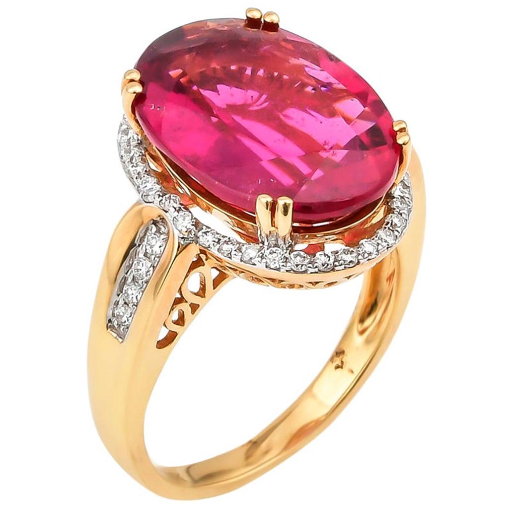 7.99 Carat Oval Shaped Rubelite Ring in 18 Karat Yellow Gold with Diamonds For Sale