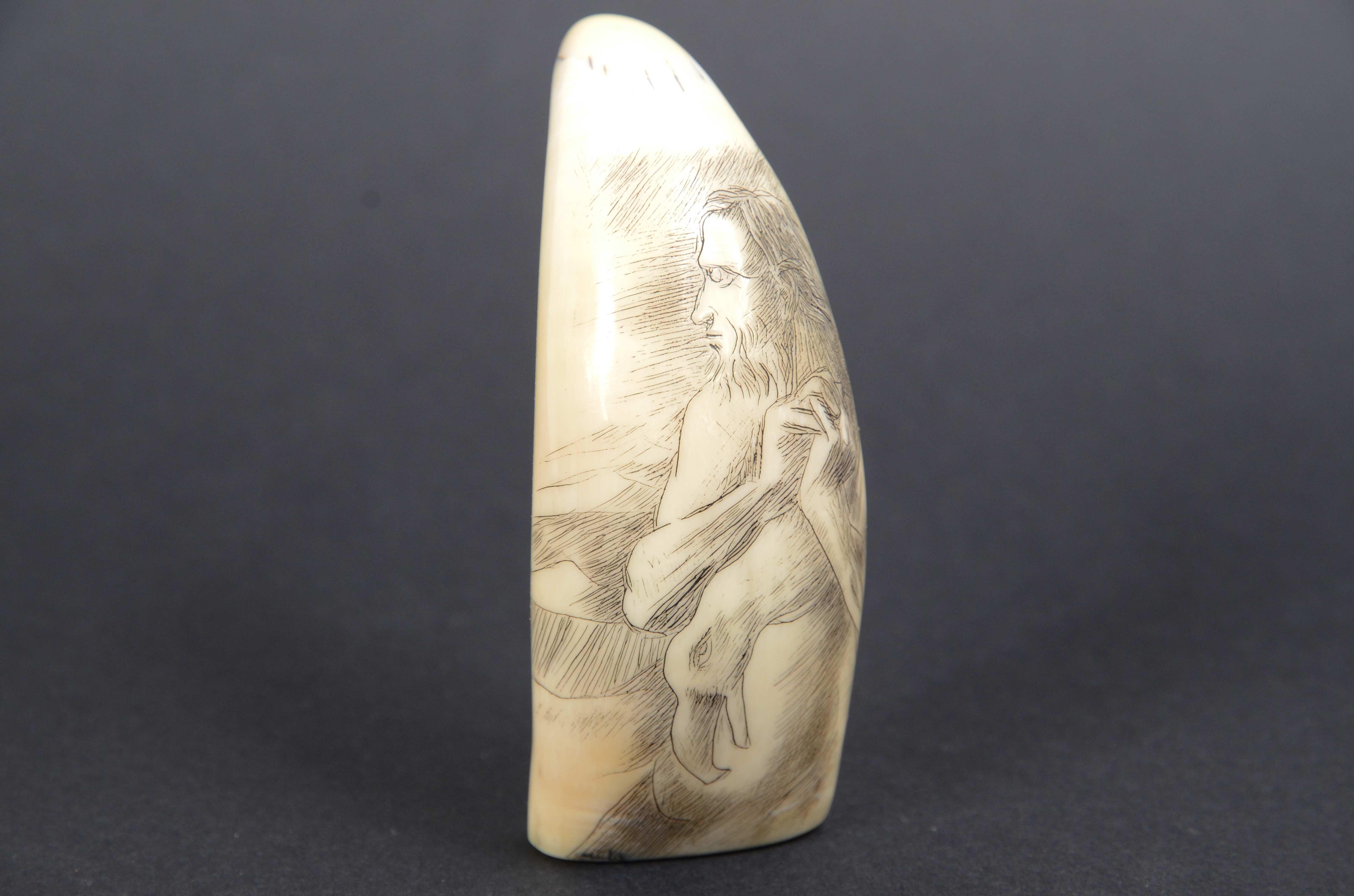 Scrimshaw of a vertically engraved whale tooth datable to around the mid-19th century depicting an old sailor with a beard and long hair holding  leaning over one shoulder a cormorant dangled in his hands. 
On the restro the following inscription: