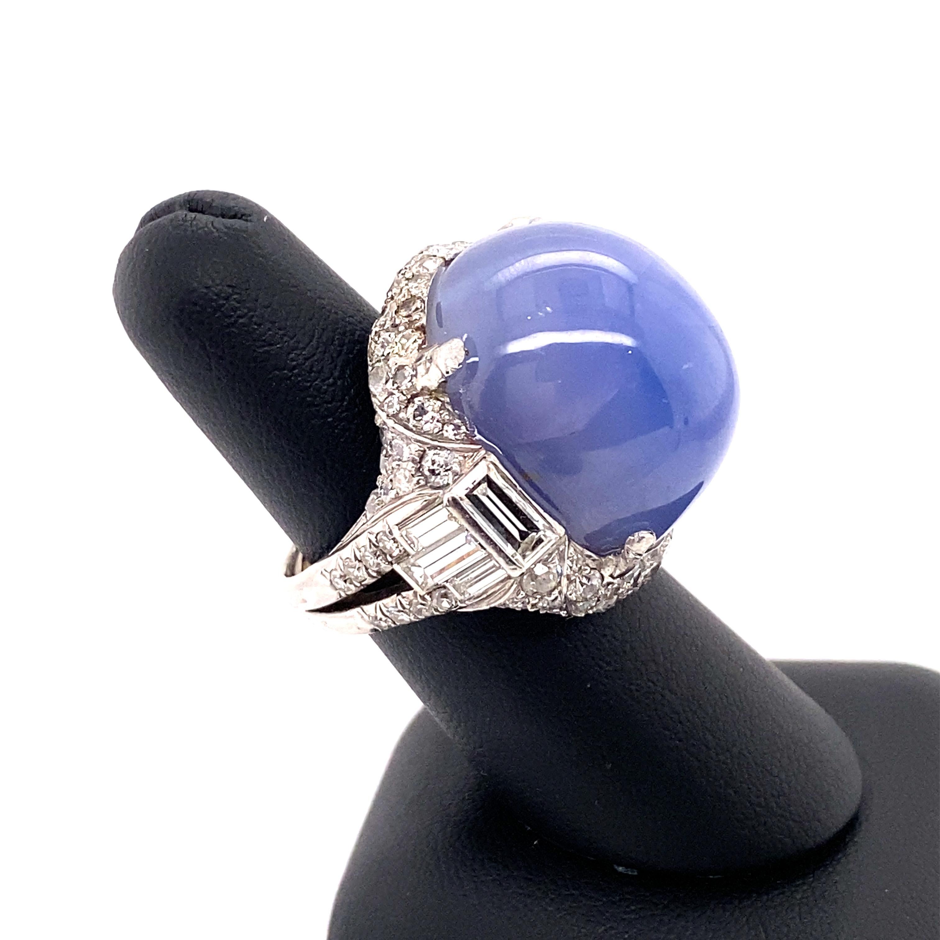 This show stopping ring features a huge 79.57-carat cabochon Ceylon unheated star sapphire which is accented by an incredible hand setting comprised of baguette, round brilliant and single-cut diamonds weighing a total of approximately 4.00