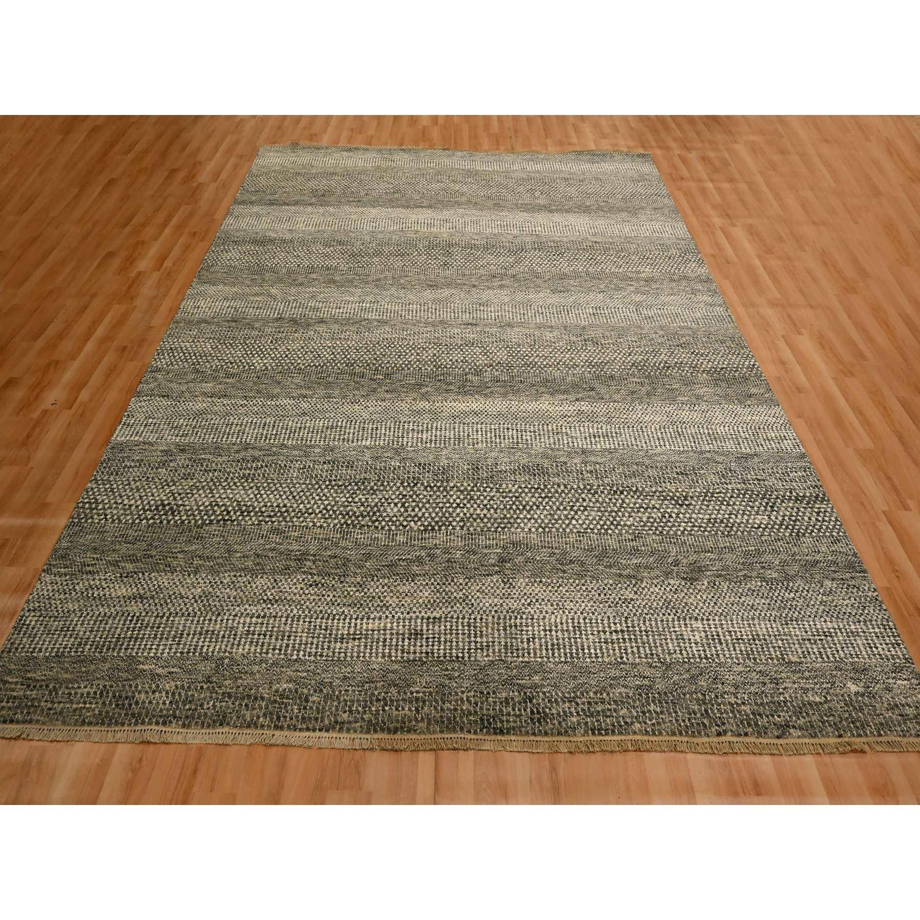 Storm Gray, Modern Grass Design, Tone on Tone, Undyed Natural Wool, Hand Knotted, Oriental Rug
Primary materials: Wool
Latex: No Pile 
height: 0.25 Inches
Style: Contemporary
Primary color: Grey
Secondary colors: Green, Ivory
Pattern: Oriental