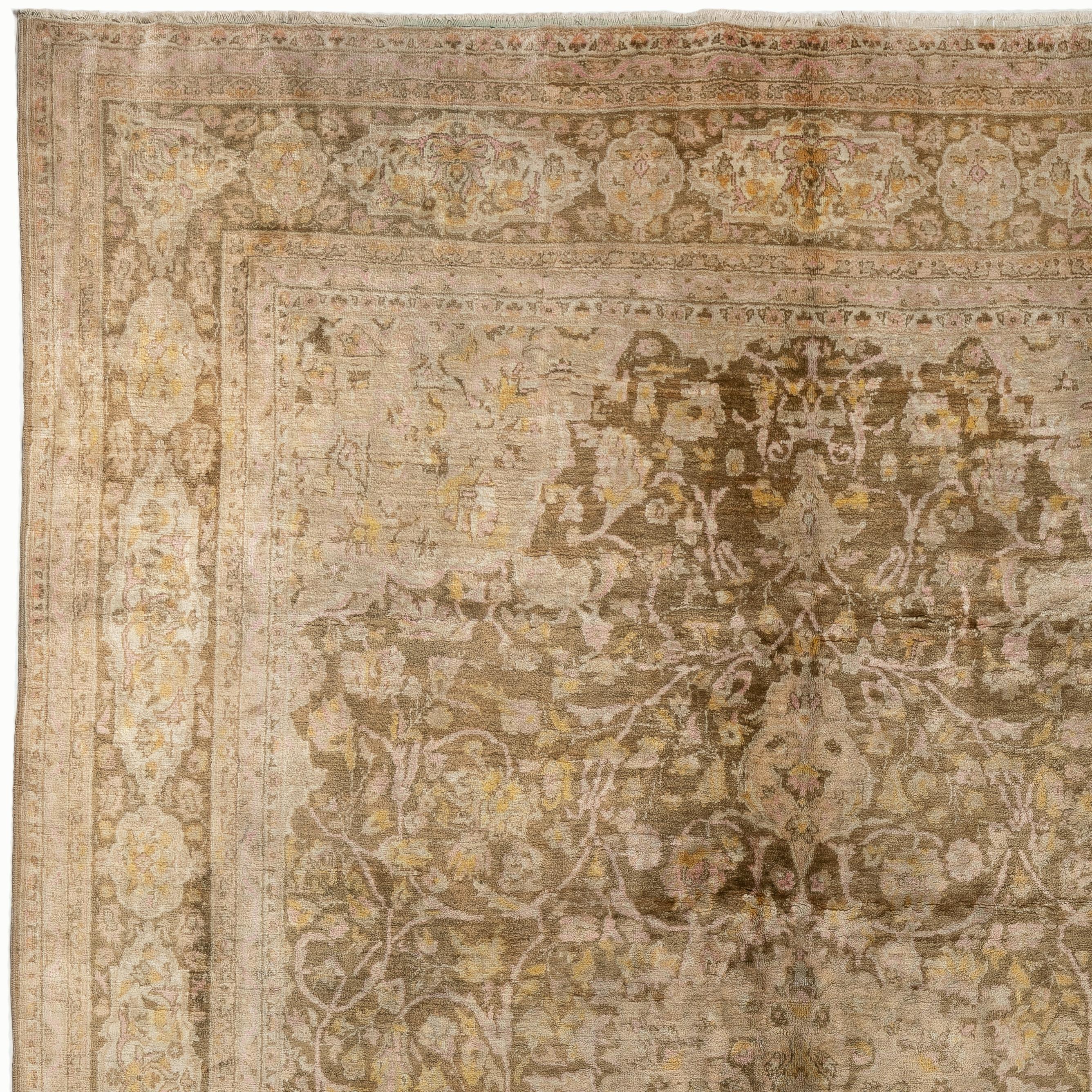A finely hand knotted wool rug from Sivas region in Eastern Anatolia that has been a famous rug making center, until late 1960s. This beautiful example is well drawn and in very good condition. Muted colors; ivory and soft golden brown with pastel