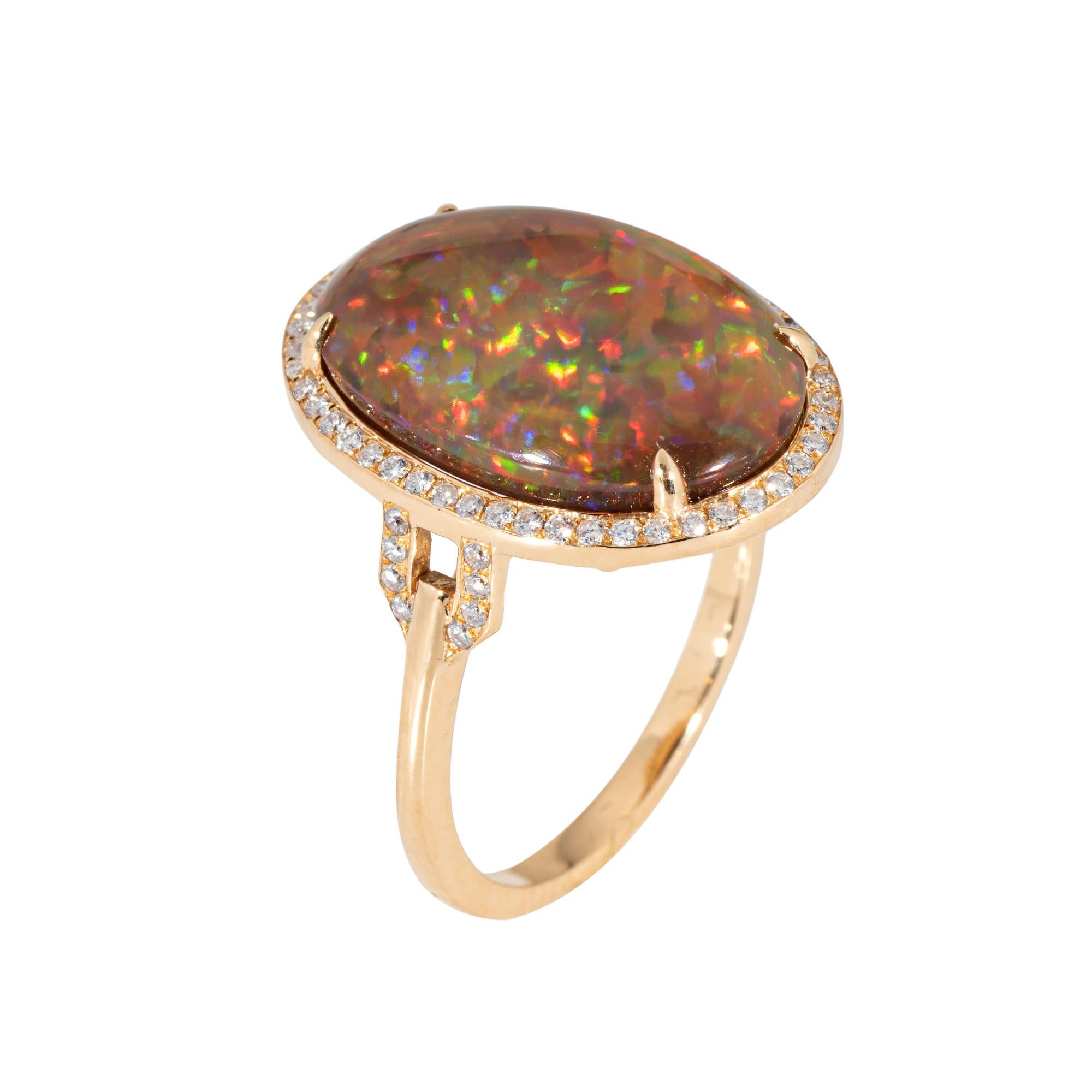 Stylish contemporary Ethiopian opal & diamond ring crafted in 18 karat yellow gold.

Natural cabochon cut oval Opal measures 18mm x 12mm (estimated at 7 carats). Diamonds total an estimated 0.32 carats (estimated at I-J color and SI2-I1 clarity).