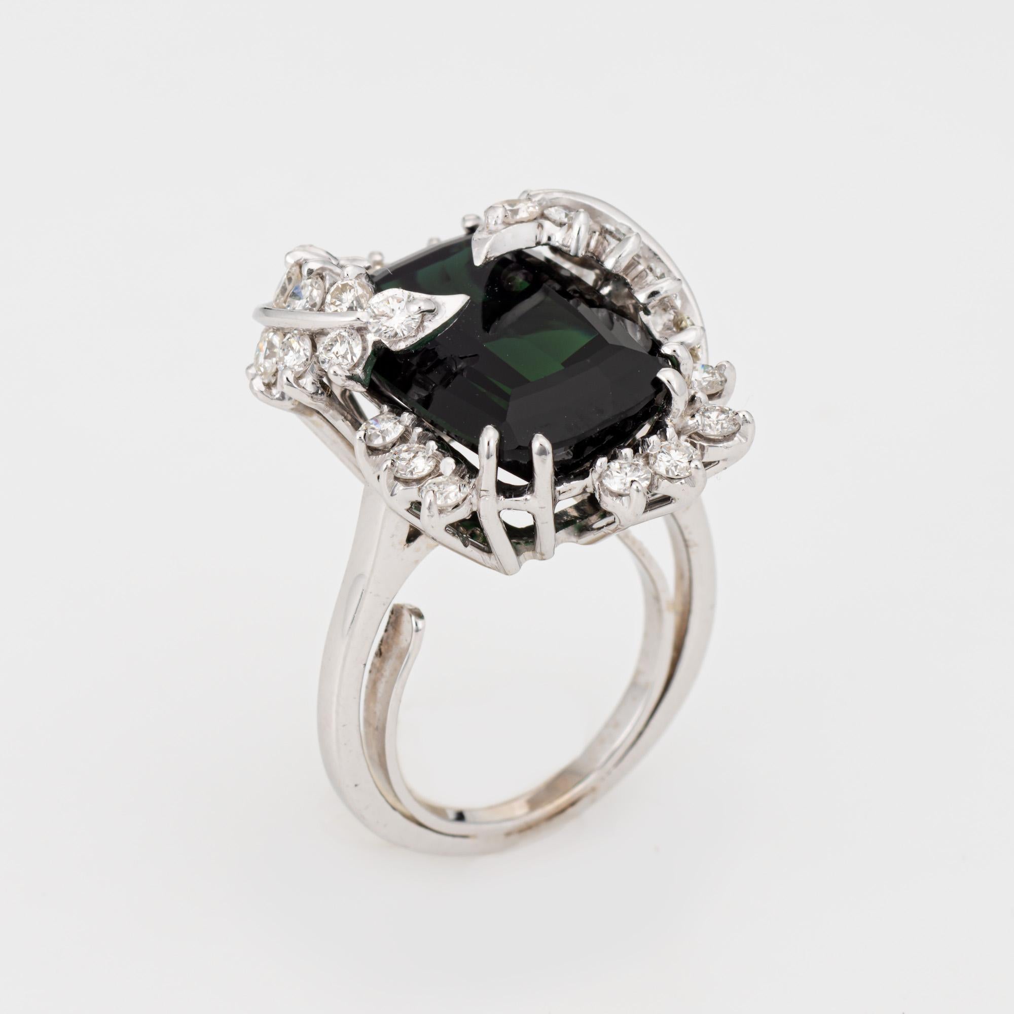 Stylish vintage green tourmaline & diamond leaf ring crafted in 14 karat white gold. 

Green tourmaline measures 15.5mm x 10mm (estimated at 7 carats), accented with an estimated 1.151 carats of diamonds (estimated at H-I color and VS2-SI2 clarity).