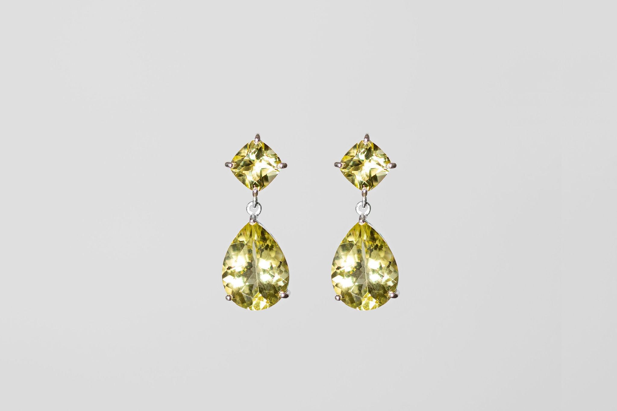 Elevate your style with these glamorous drop earrings. Handmade using recycled sterling silver and Lemon Quartz Amethysts. The pear-shaped stone is 6 carats, and the square top stone is 1ct. They are exceptionally well cut and crafted using upcycled