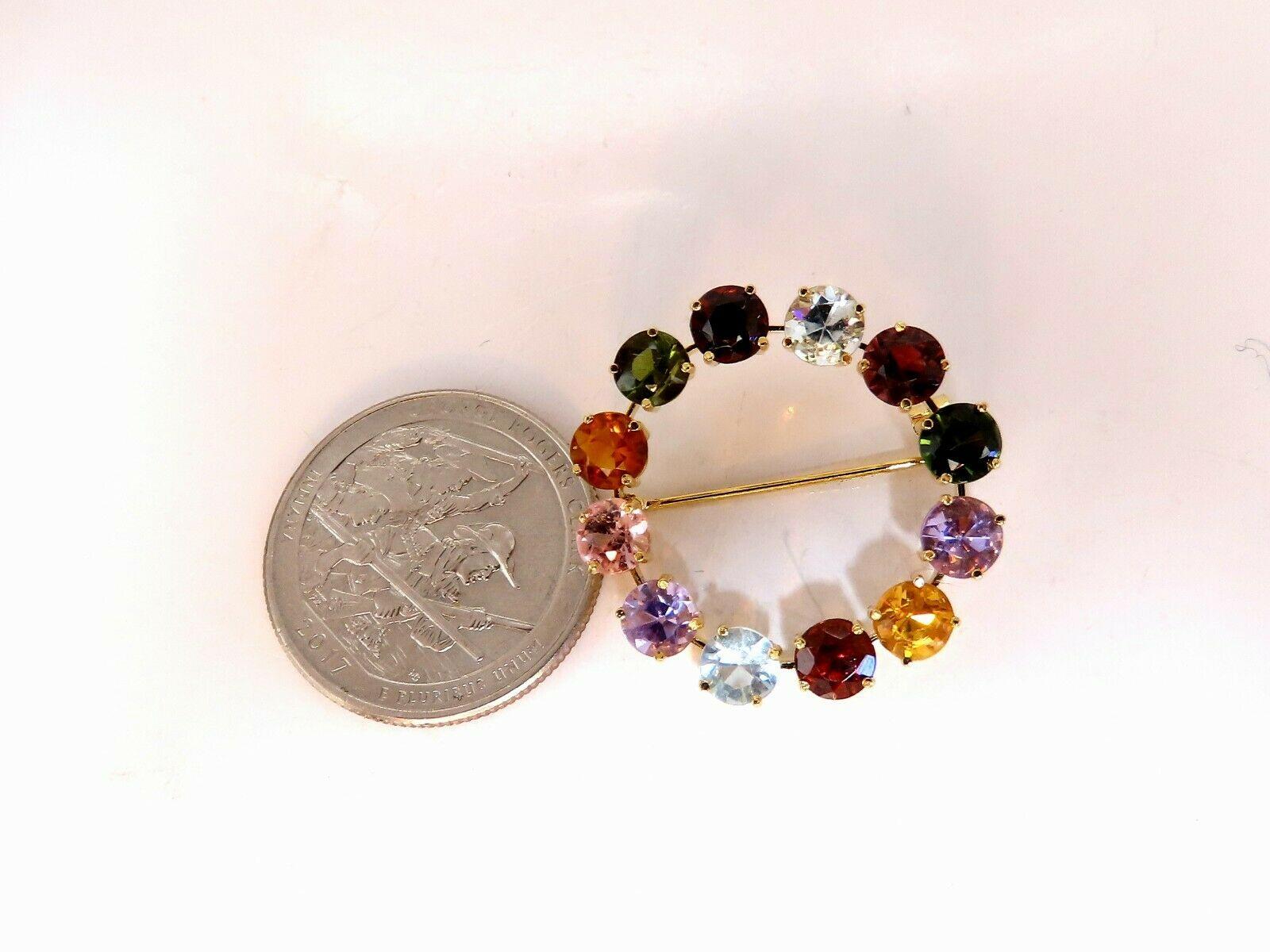 Vintage Endless Circle Brooch Pin.

7.00cts of natural gems.

Pink Spinel, Peridot, Citrine, Garnet, Pink Tourmaline, Amethyst & Aquamarine.

Round cuts

Each Stone: 4.8mm average

Rounds, Full cut Brilliant.

Clean Clarity & Transparent

14kt