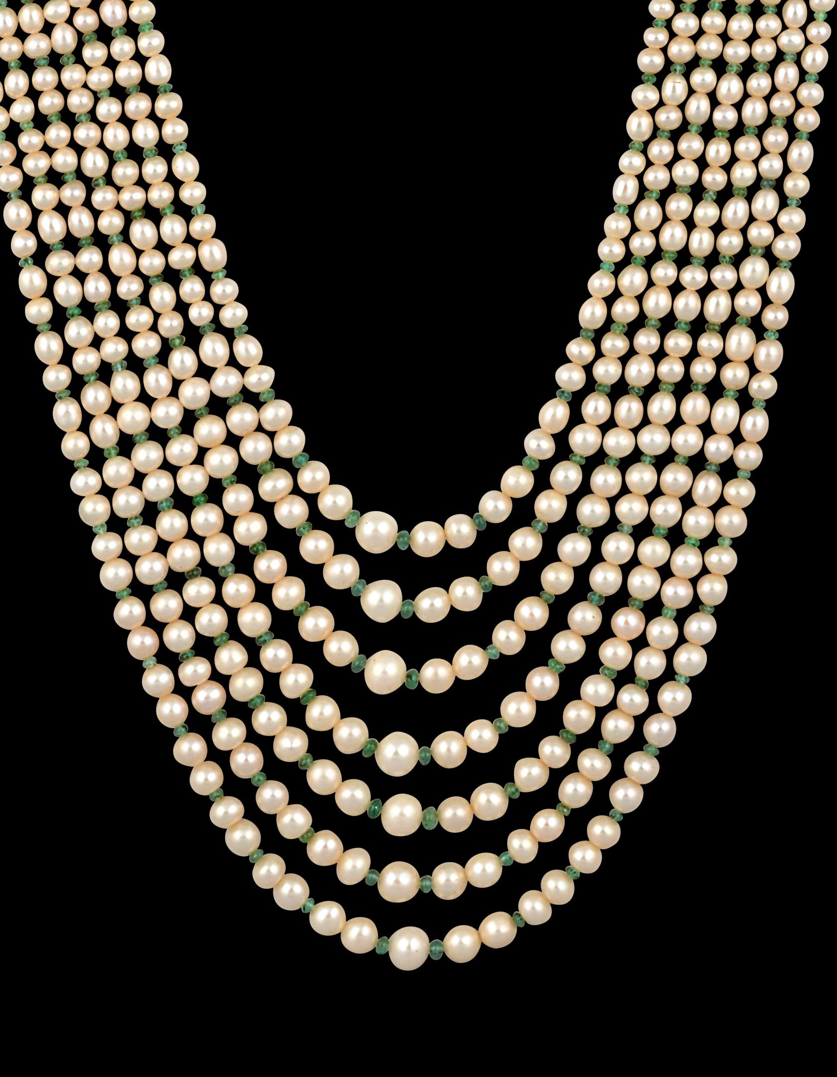  7 Layers of  Fresh water  Pearl with Emerald Beads with  14 Karat yellow gold Spacer clasp Opera Length Necklace
The opera length multi layer pearl necklace set consists of 7  original strands of Natural pearls of lovely nacre, lustre, and