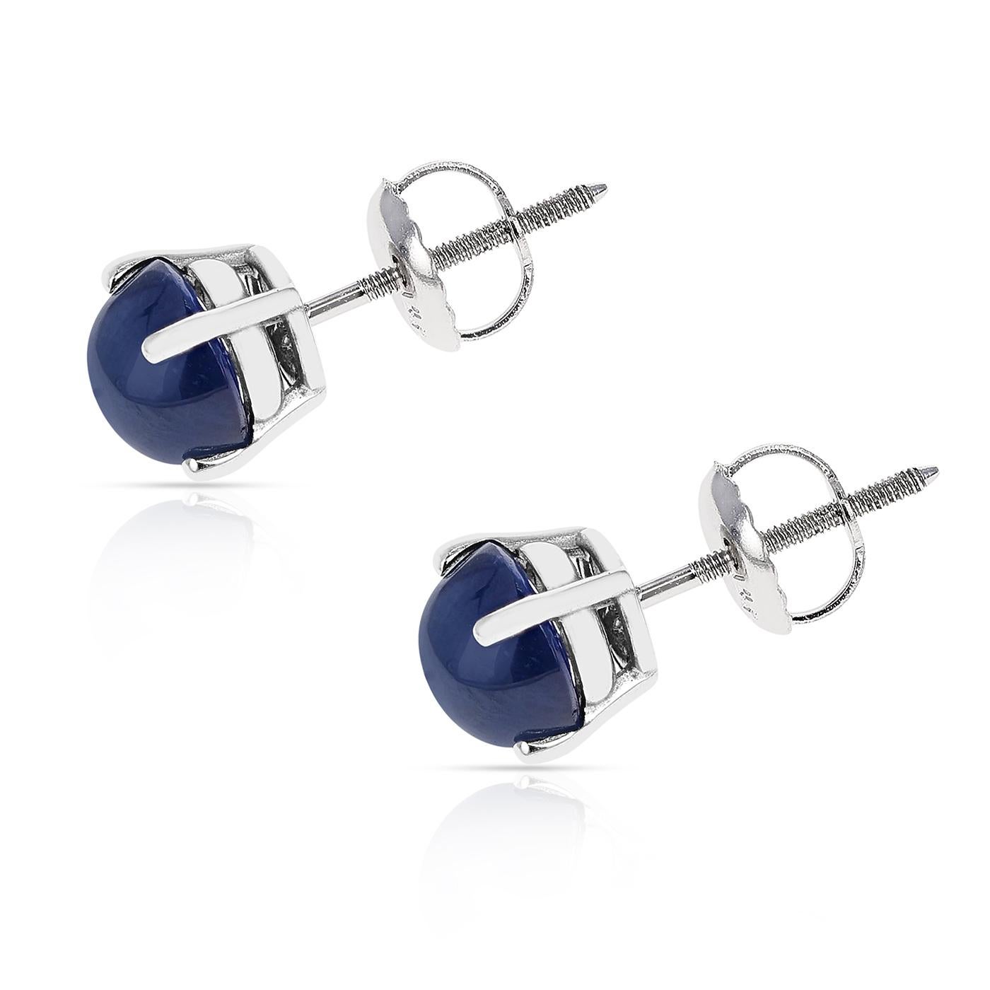 A pair of 7MM Blue Sapphire Round Cabochon Stud Earrings made in 14 Karat White Gold. The total stone weight ranges from approximately 3.69 - 4.86 carats.