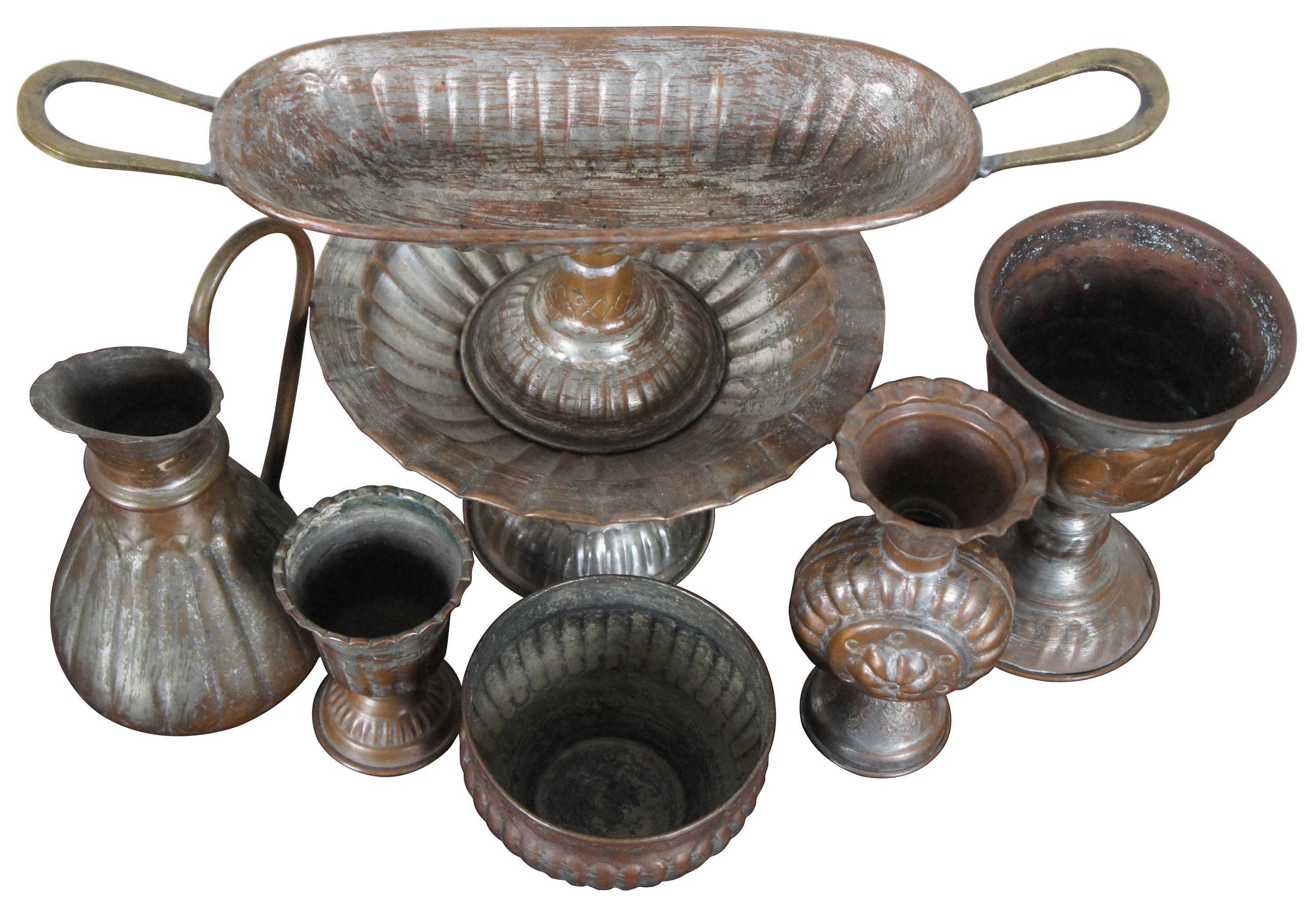 Lot of seven assorted vintage copper/tin pieces including two centerpiece compotes, a small pitcher, large goblet, small goblet, small planter and a vase. Only one hallmarked.

Largest Piece - 9” x 5.5” / Smallest Piece - 3” x 4” (Diameter x