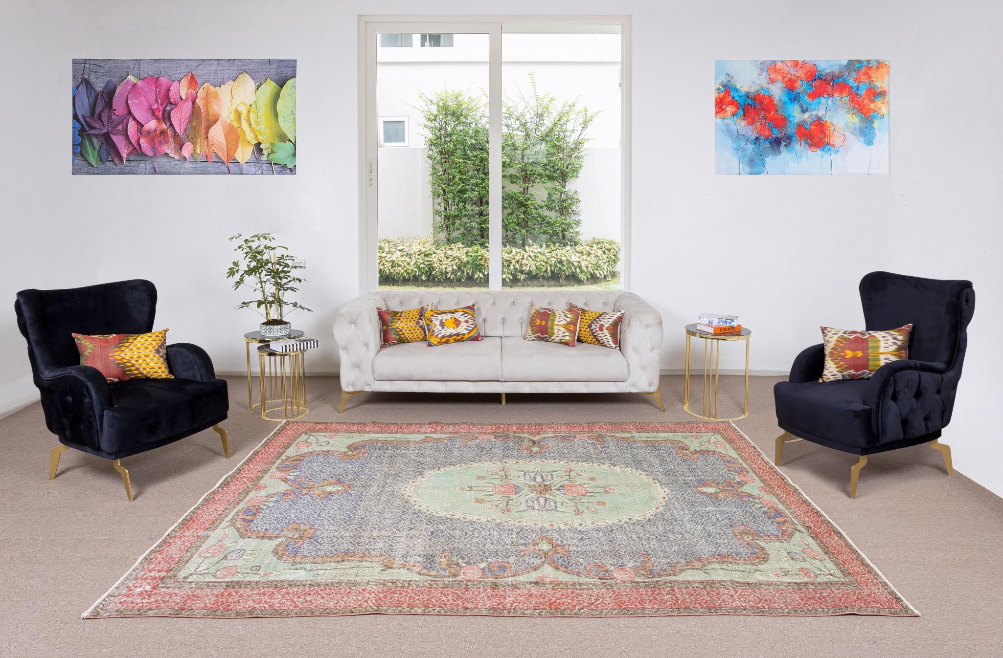 A finely hand-knotted vintage Turkish carpet from 1960s featuring an elegant floral design. The rug has even low wool pile on cotton foundation. It is heavy and lays flat on the floor, in very good condition with no issues. It has been washed