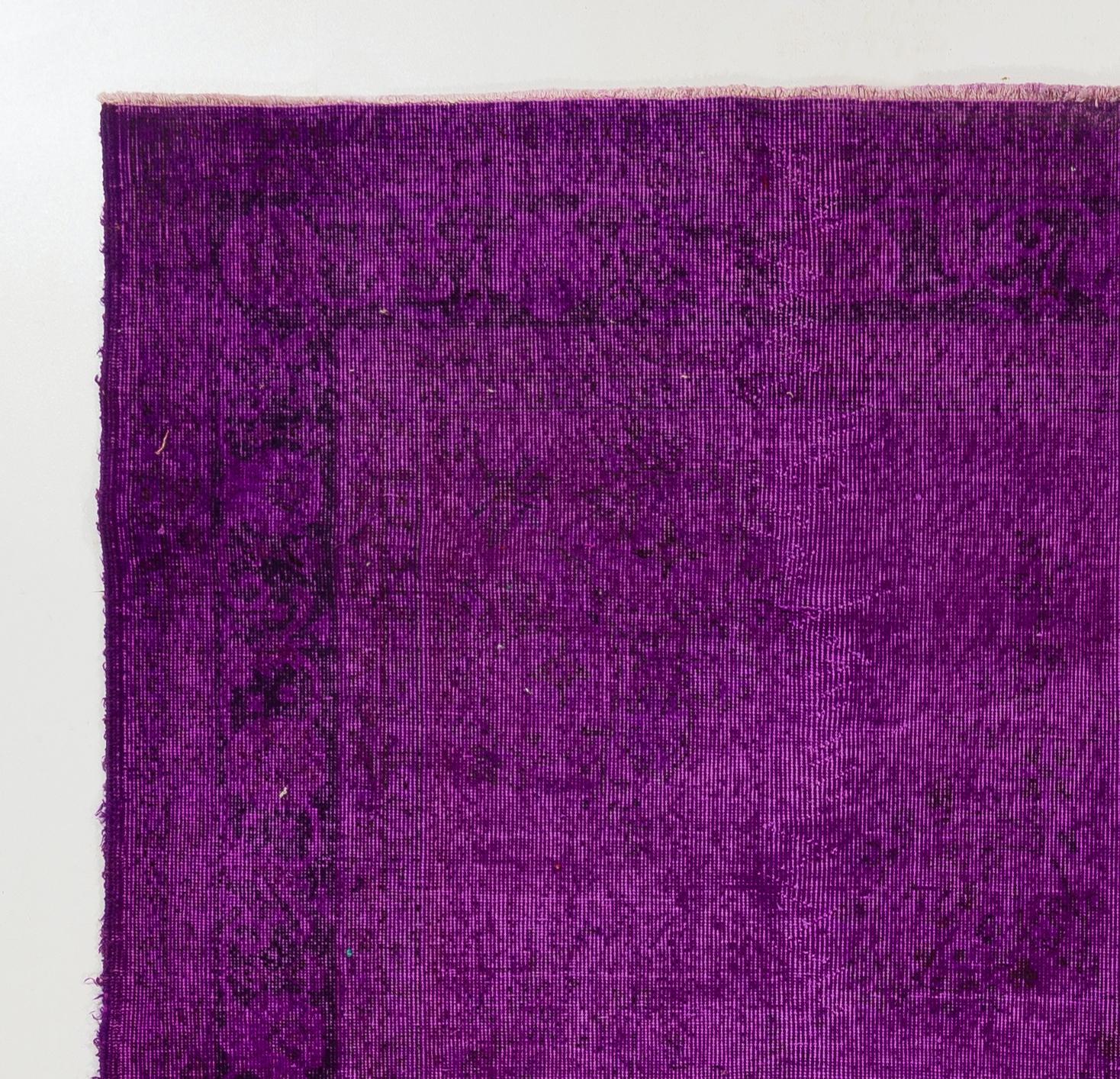 A vintage Turkish area rug re-dyed in purple color for contemporary interiors.
Finely hand knotted, low wool pile on cotton foundation. Professionally washed.
Sturdy and can be used on a high traffic area, suitable for both residential and