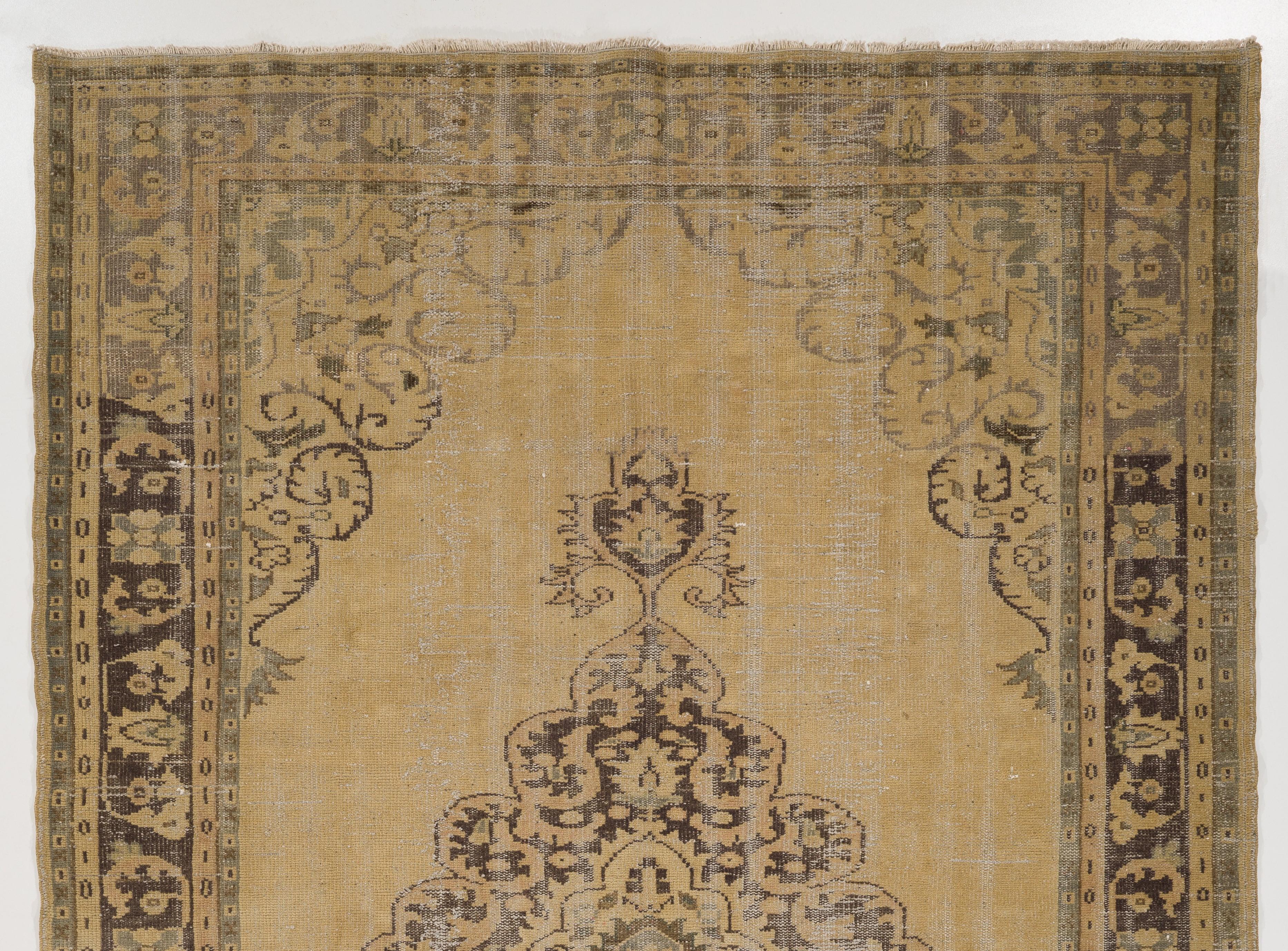 A finely hand knotted rug from West Anatolia with soft colors and low wool pile on cotton foundation. The rug is in very good condition and washed professionally. It is heavy and lays flat on the floor, suitable for both residential and commercial