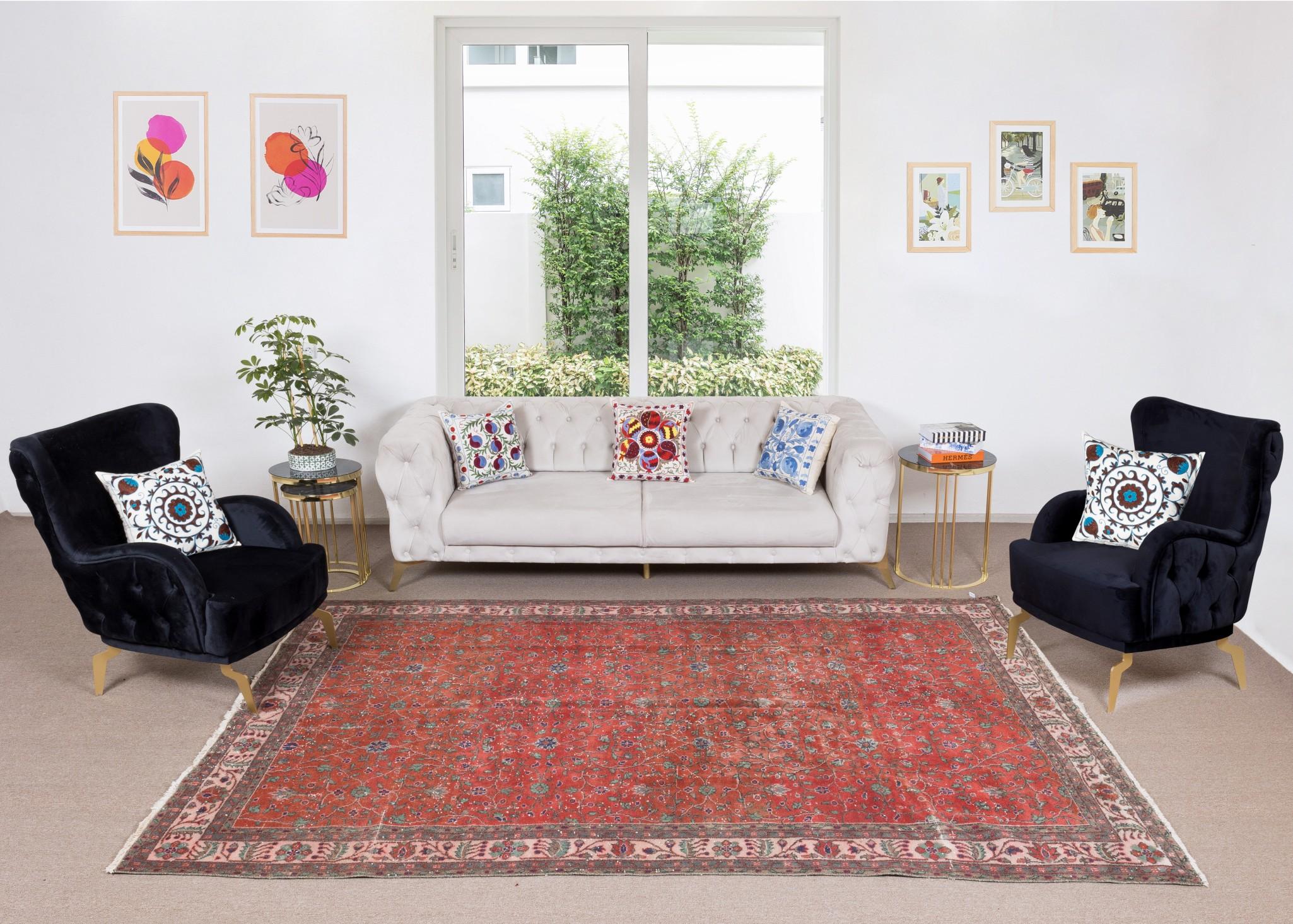 A finely hand-knotted vintage Turkish carpet from 1960s featuring a floral design. The rug has even low wool pile on cotton foundation. It is heavy and lays flat on the floor, in very good condition with no issues. It has been washed professionally,