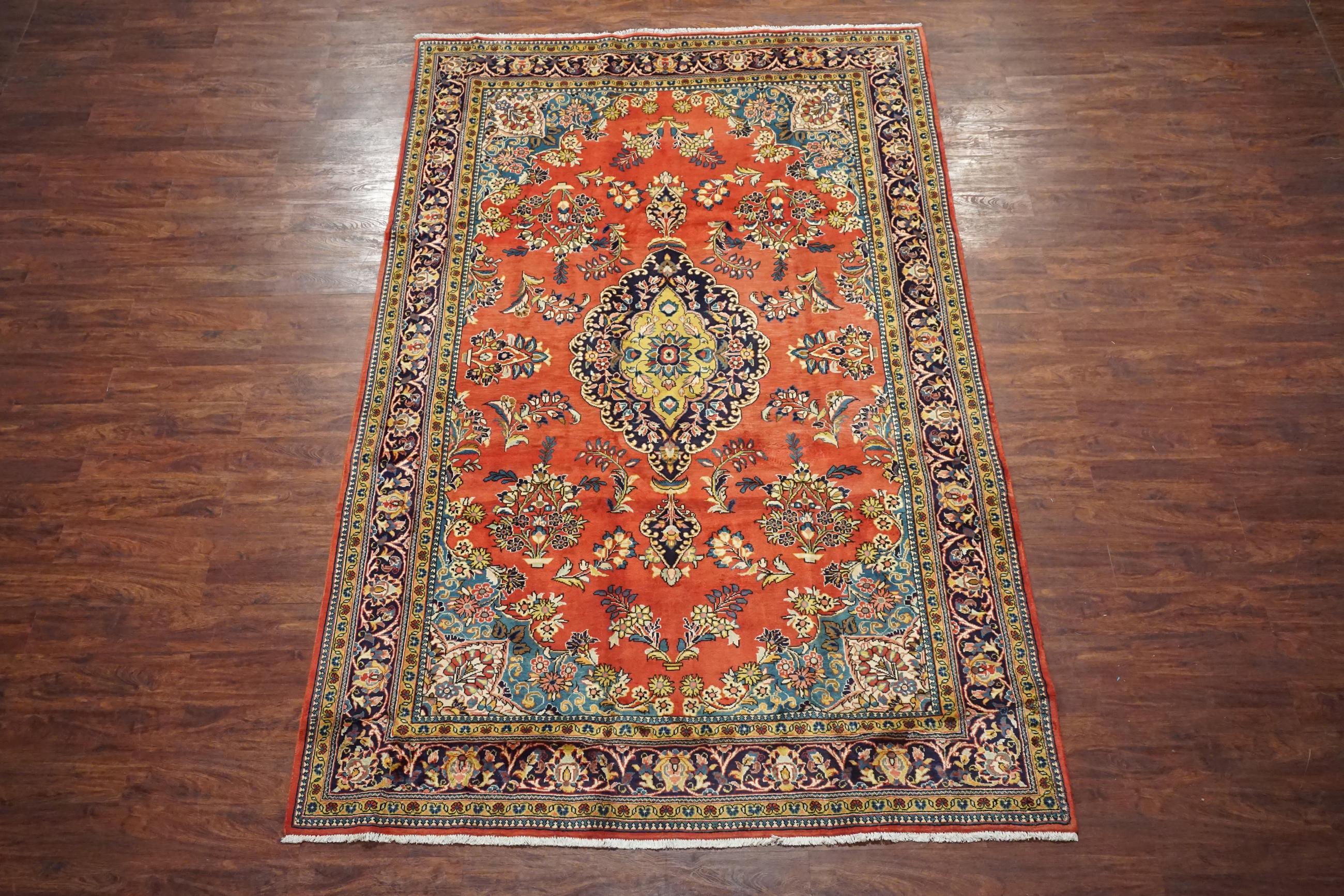 Hand-knotted wool pile on a cotton foundation.

Circa 1940

Dimensions: 7' x 11'

Condition: Excellent for its age

Origin: Iran

Field Color: Rust-Red

Border Color: Midnight-Blue

Accent Colors: Light-Blue, Gold, Ivory