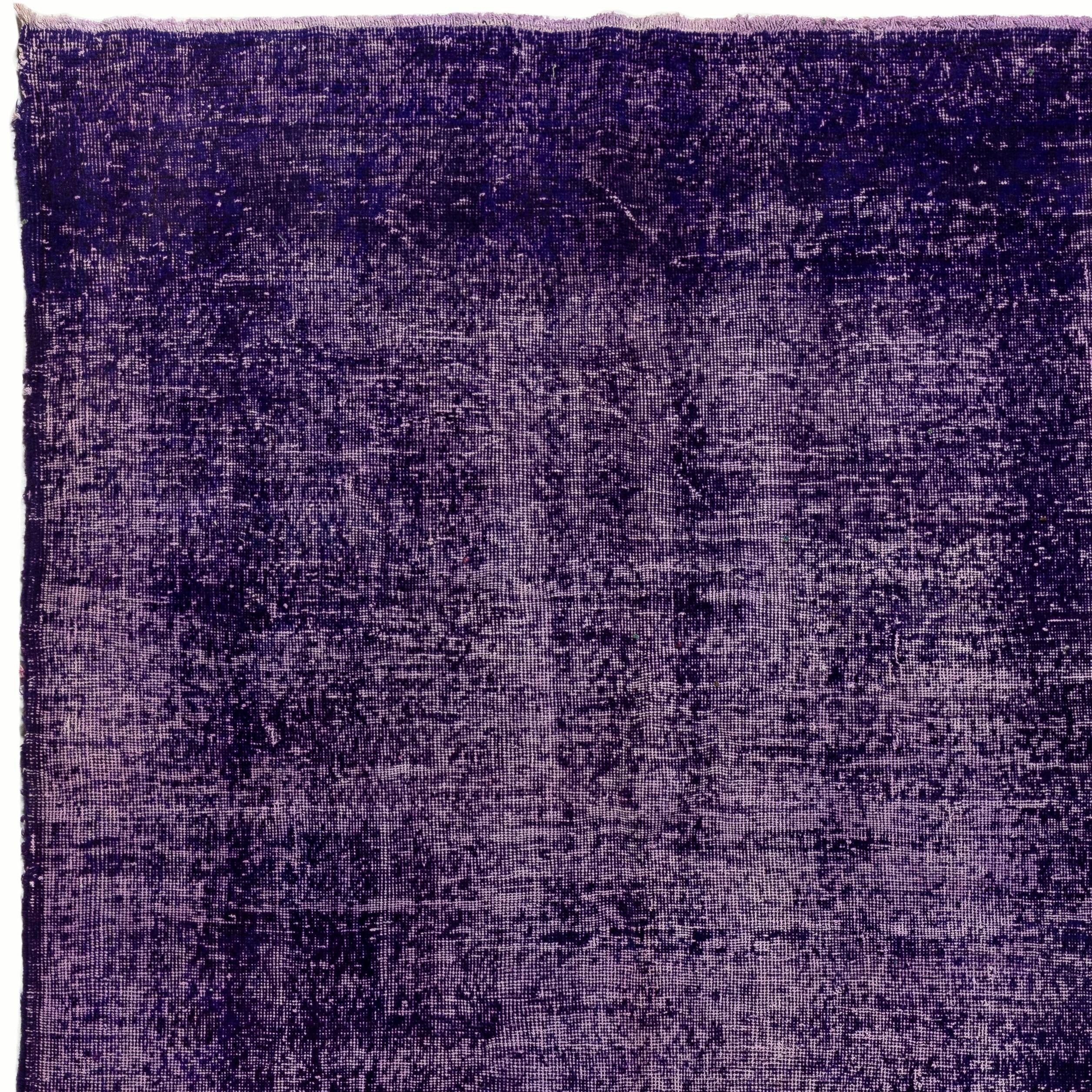 A distressed vintage Turkish rug re-dyed in purple color. Measures: 7 x 11.2 ft.
Finely hand knotted, low wool pile on cotton foundation. Washed professionally. 
Sturdy and can be used on a high traffic area, suitable for both residential and