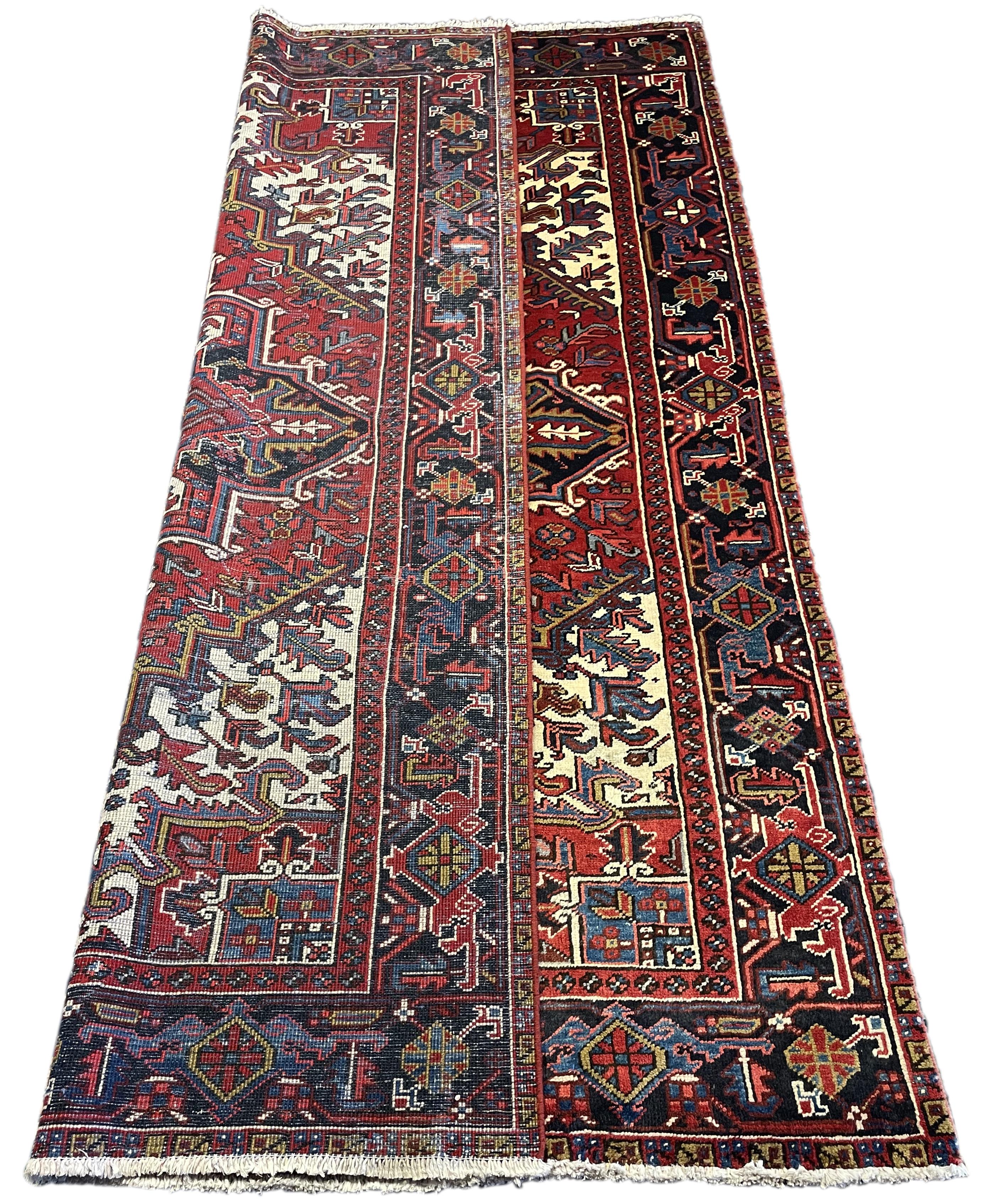 Immaculate 60's Persian Heriz. The Heriz is the most popular oriental rug in the world and it is easy to see why! The design is so popular and attractive that countries all over the world try to recreate these pieces. All of our Heriz's were woven