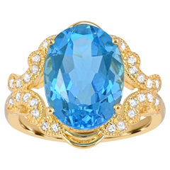 8-1/6 ct. Bague en or jaune 14 carats sur argent sterling avec topaze bleue et blanche