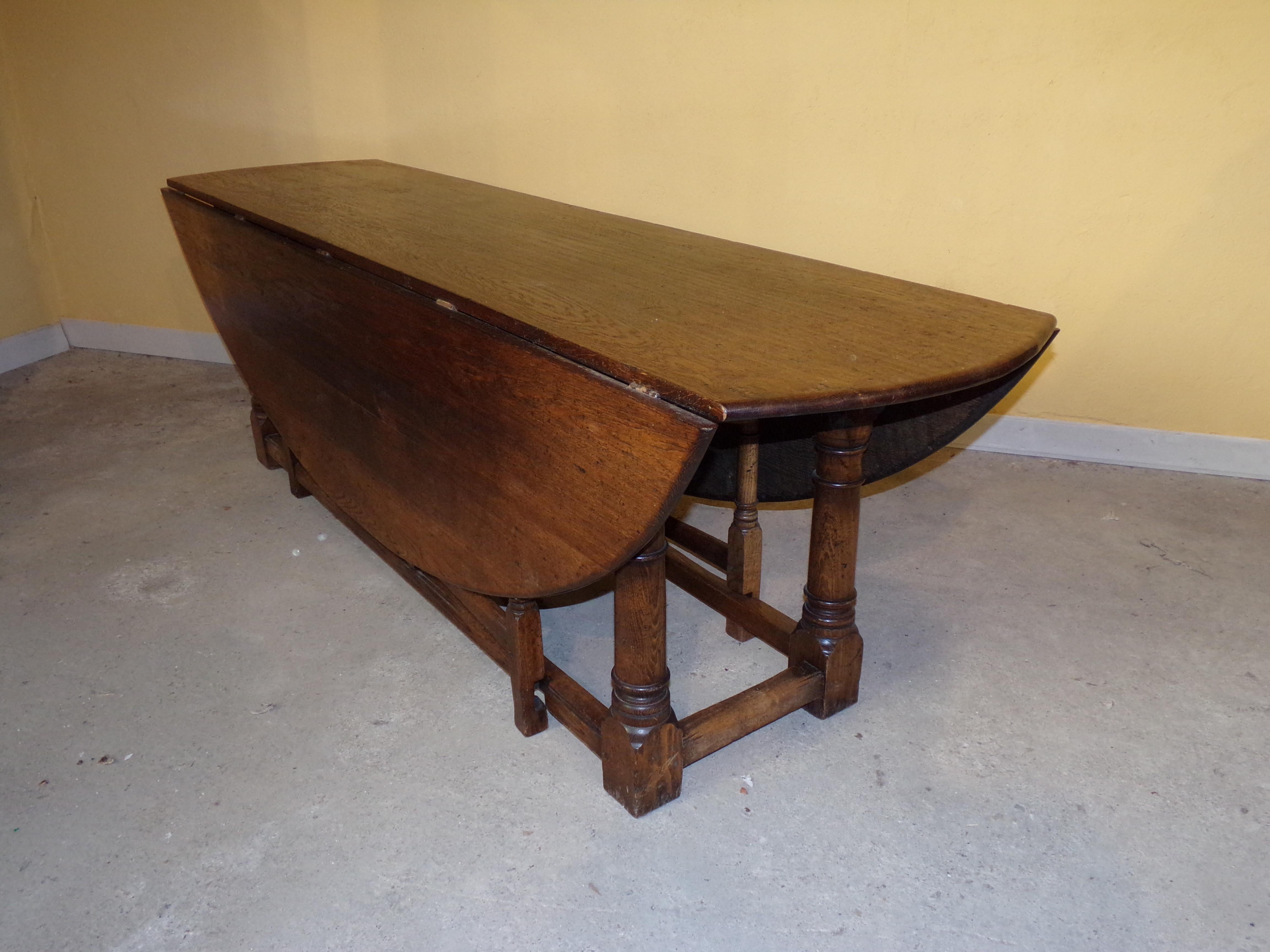 A grand sold oak English oval double gate gateleg table to seat 8-10 people, This magnificent table has 