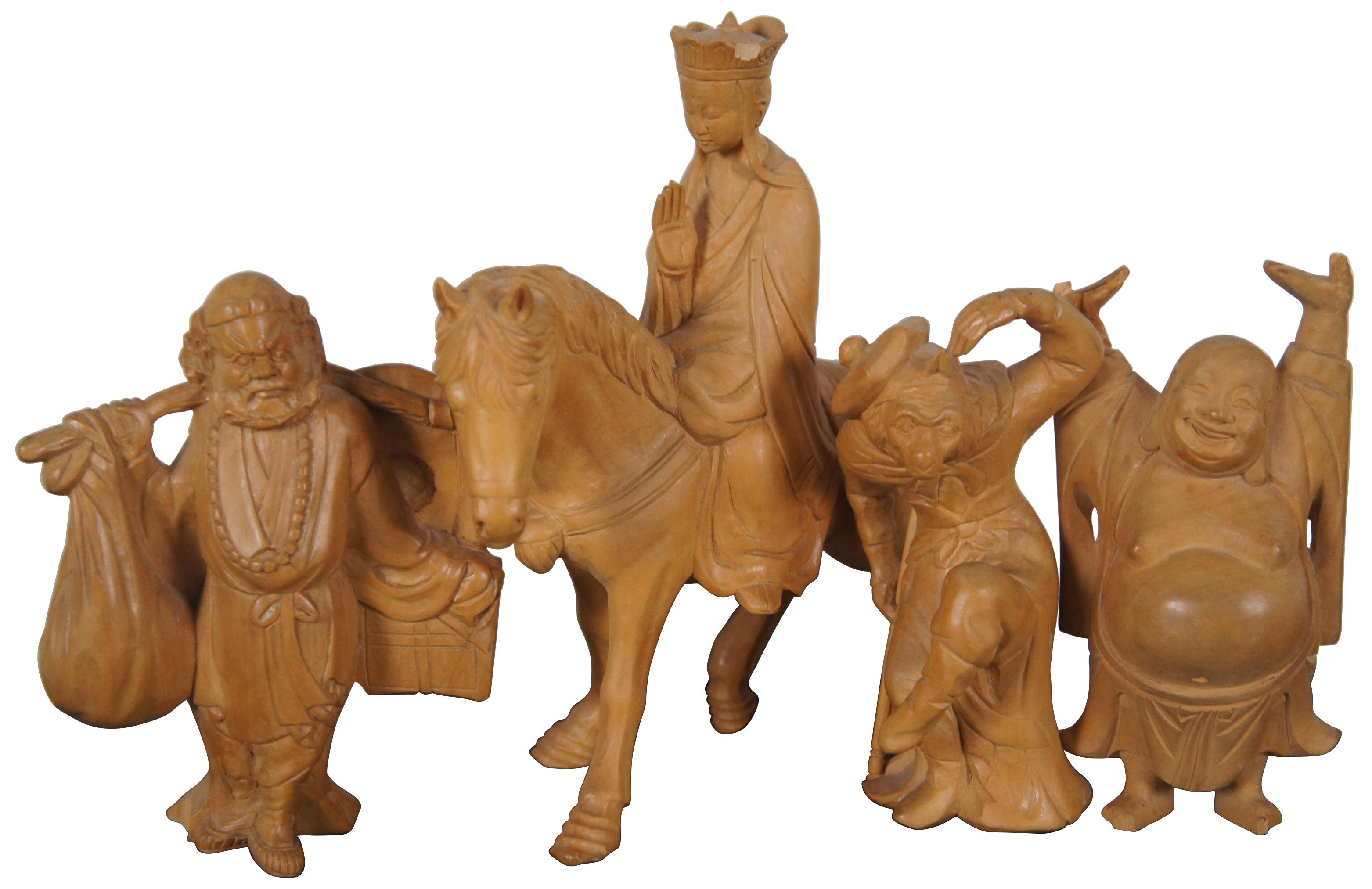 Lot of eight assorted Chinese figurines, hand carved in Taipei, Taiwan. Included: Laughing Buddha (Hotei), Sanxing dieties Fuxing and Shouxing, “Journey to the West” characters Sun Wukong (Monkey King), Zhu Bajie (Pigsy), Tang Sanzang (Tripitaka)