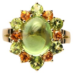 8, 4 ct. Bague en or 18k avec tourmaline verte, péridot et saphirs orange