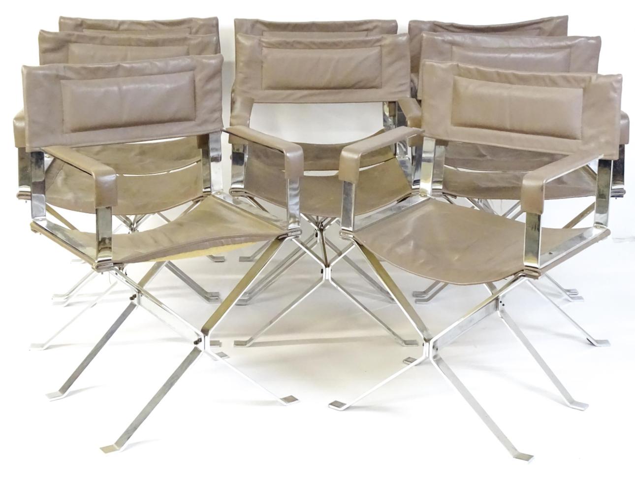 Remarkable set of 8 absolutely stylish director's armchairs with sleek polished  X frames for added support and stability, with fine Italian grey stitched leather sling backs and seats. Highly decorative comfortable chairs, designed in the manner of