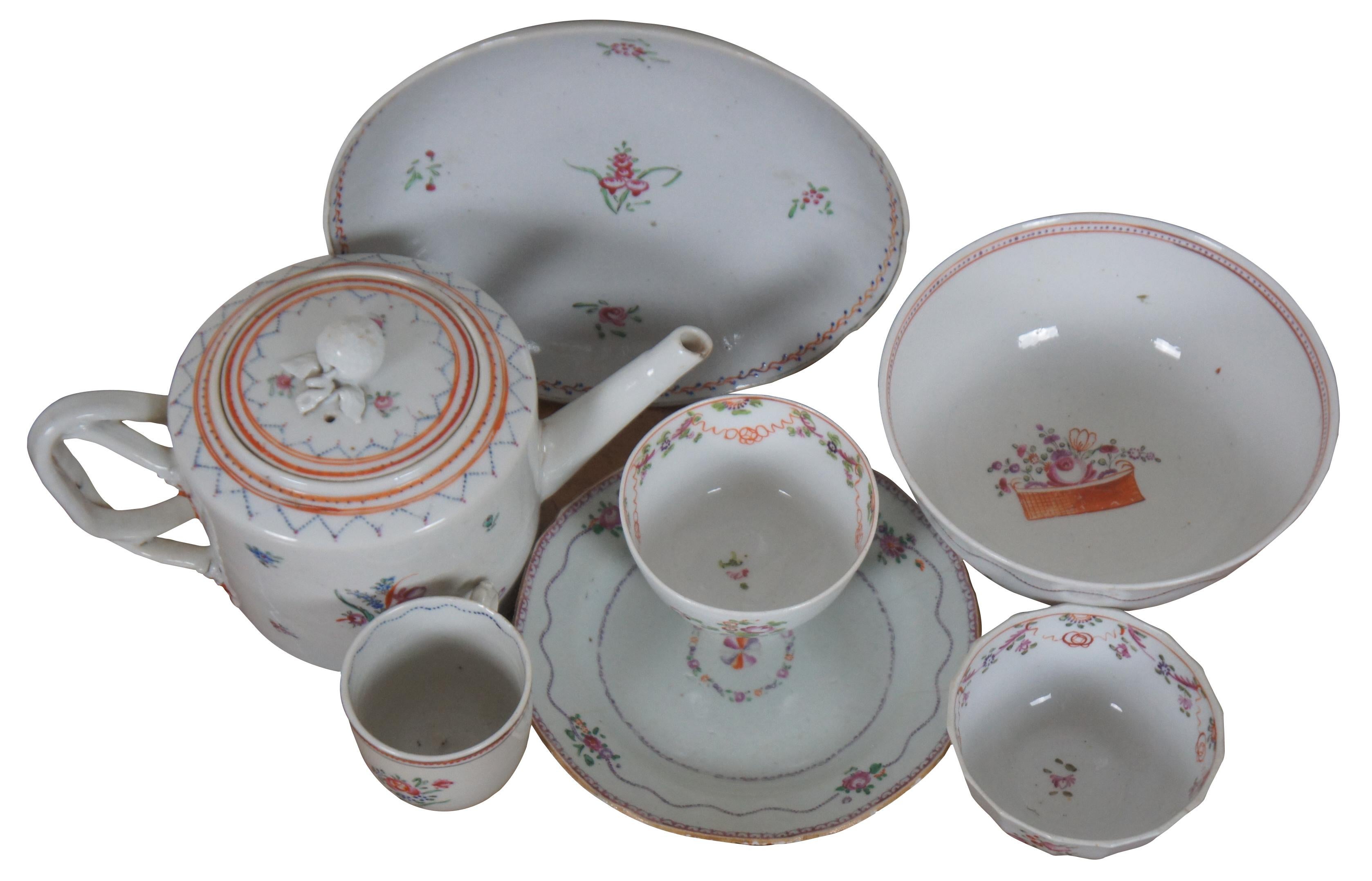 Lot of eight late 18th to early 19th century Chinese Export (Qianlong Period, circa 1780) porcelain serving pieces with hand painted floral and swags. Features teapot, tea / coffee cups, plate, soup bowl and shallow bowl.

Teapot - 9” x 5” x 5” /