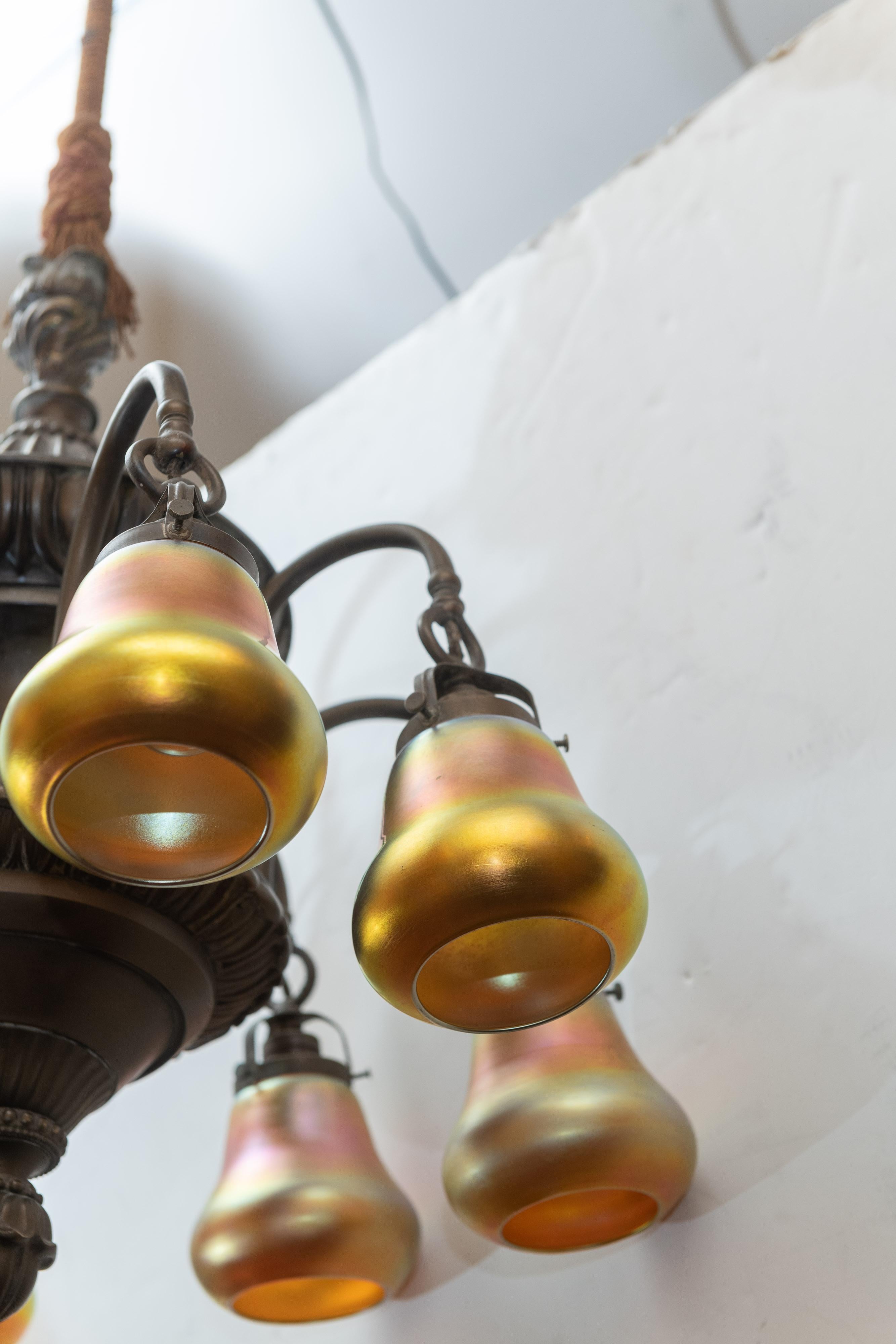 American 8-Arm Edwardian Chandelier in Bronze with 8 Steuben Art Glass Shades, circa 1910