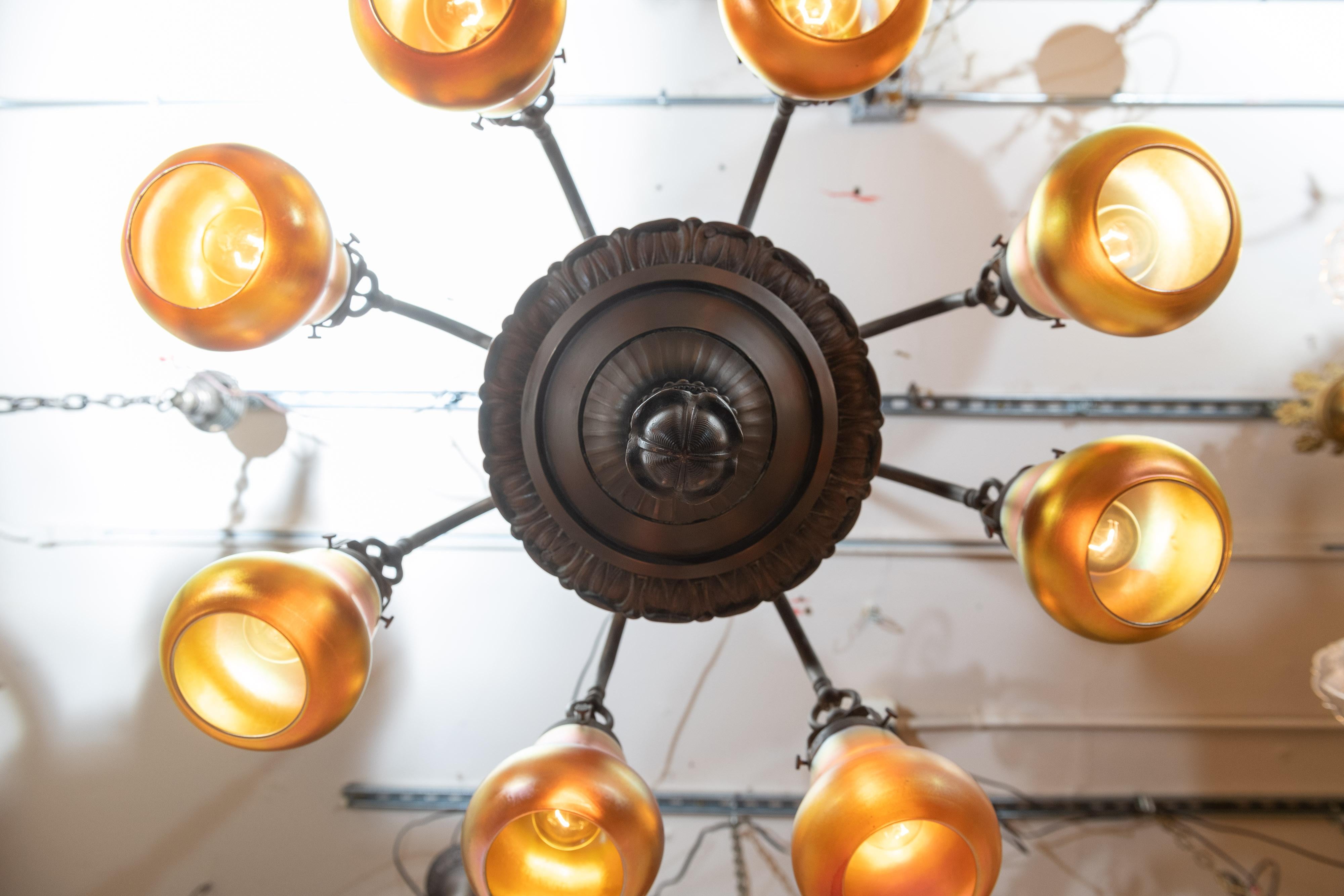 Early 20th Century 8-Arm Edwardian Chandelier in Bronze with 8 Steuben Art Glass Shades, circa 1910