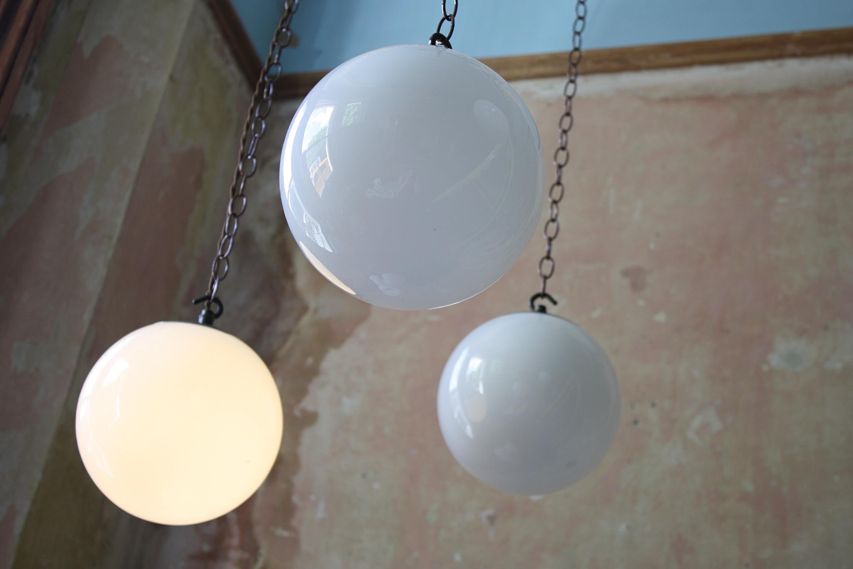 8 Available Mid-20th Century Small Glass Opaline and Brass Globe Pendants Lights In Good Condition In Lowestoft, GB