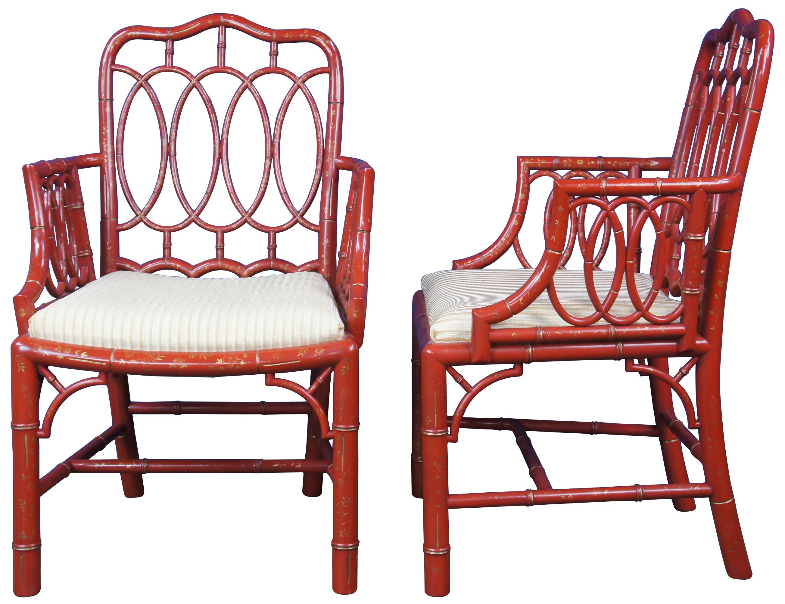 A rare and important set of 8 Baker Furniture Chinese Chippendale Loop or Hoop back dining armchairs, circa mid 20th century Featuring faux bamboo pierced bentwood frame with red lacquer finish and hand painted gilt floral accents. An archive style