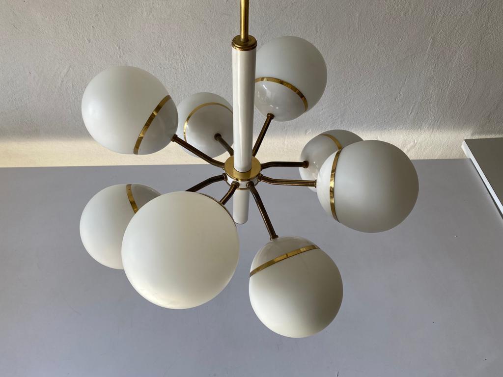 Wonderful 8 ball glass shade and white metal body atomic chandelier by Kaiser Leuchten, 1970s, Germany

The lamp is in very good vintage condition. 

This lamp works with E14 light bulbs.
Wired and suitable to use with 220V and 110V for all